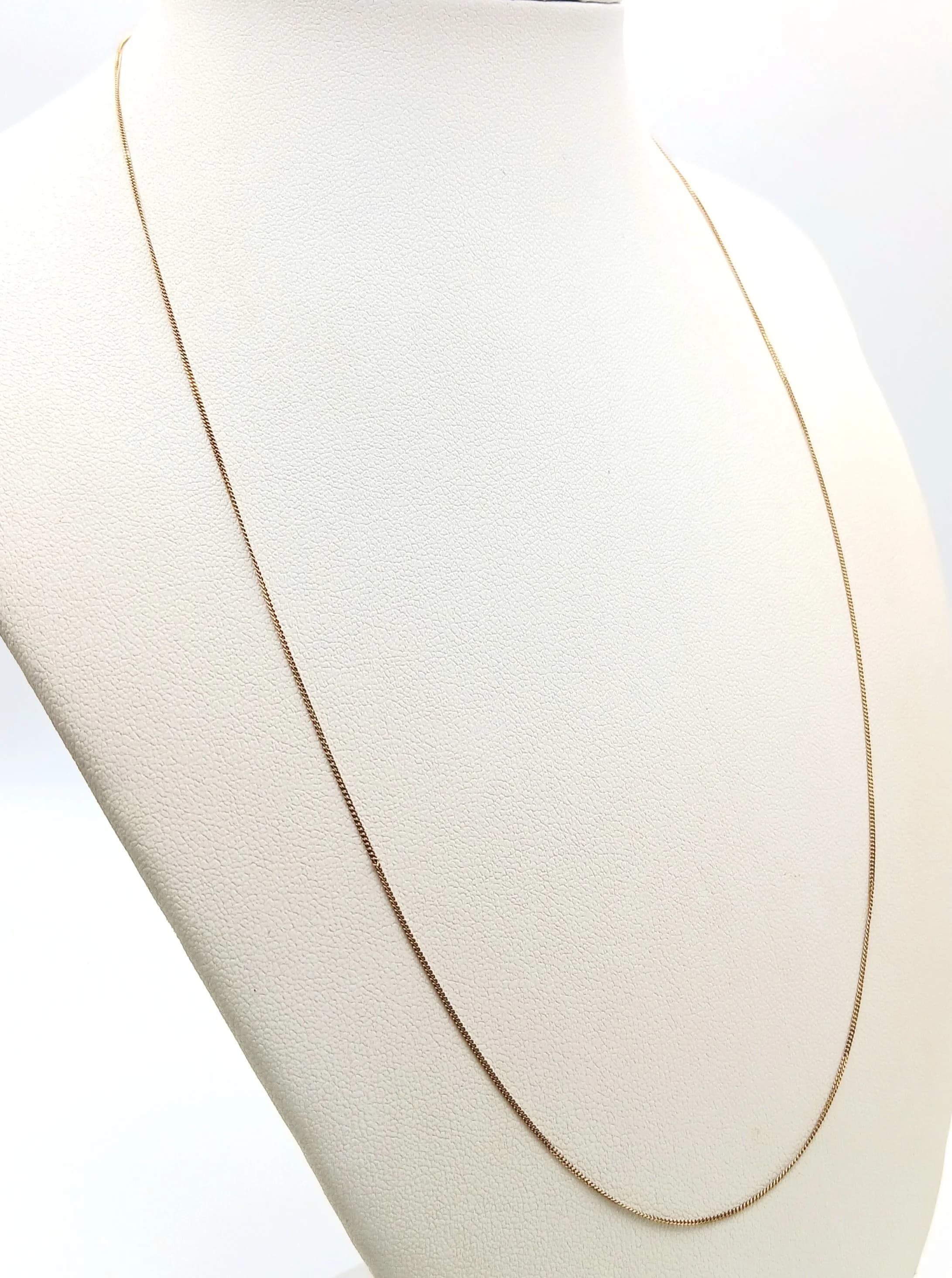 A 9K Yellow Gold Disappearing Necklace. 50cm length. 0.85g.