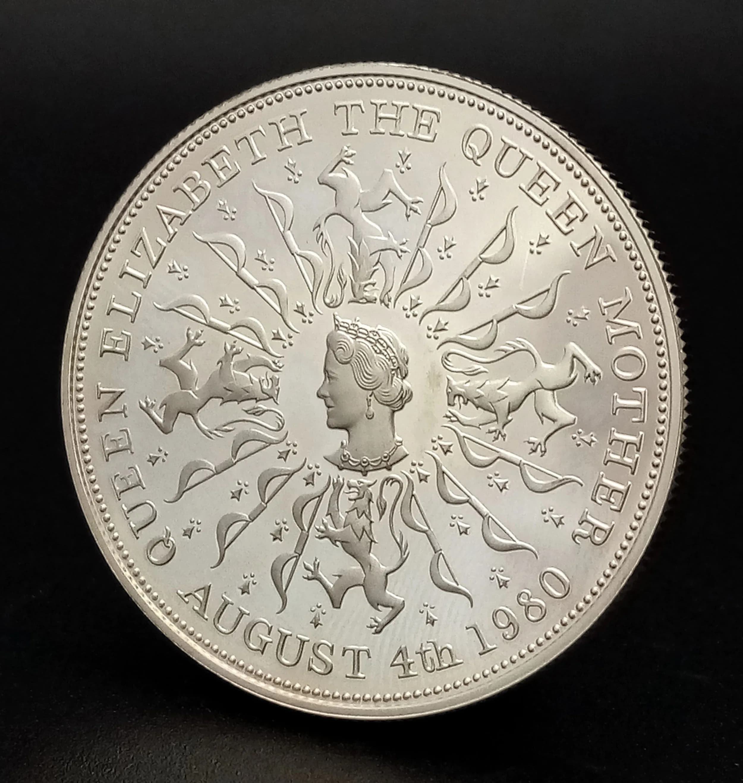 A Royal Mint Queen Elizabeth, The Queen Mother 80th Birthday Proof Commemorative Crown Coin. Encapsulated with COA and case. 28.27g.