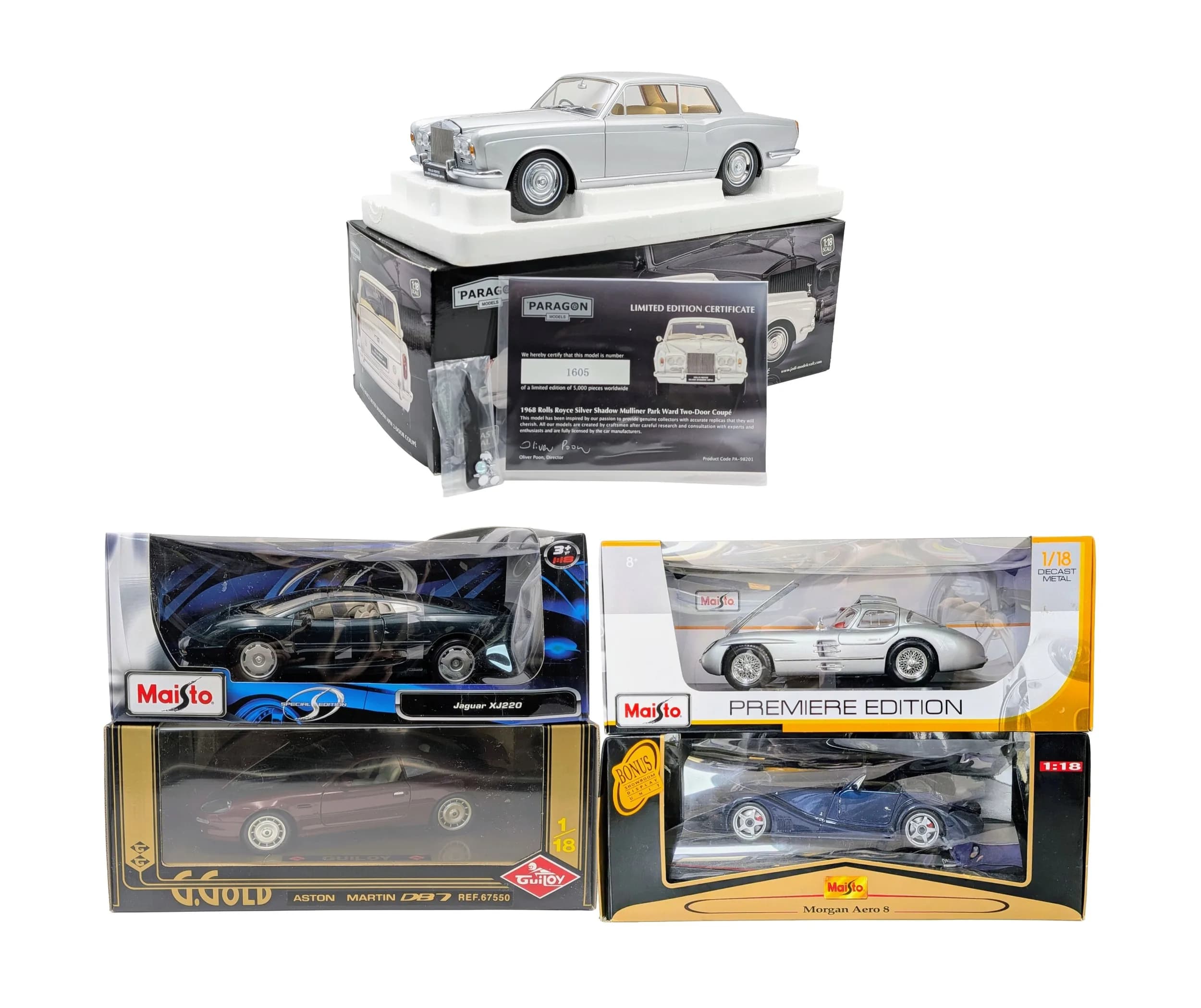Five 1/18th scale die cast cars. By Paragon, Guitoy & Maitso. Good condition but a couple of the boxes have some wear from storage.