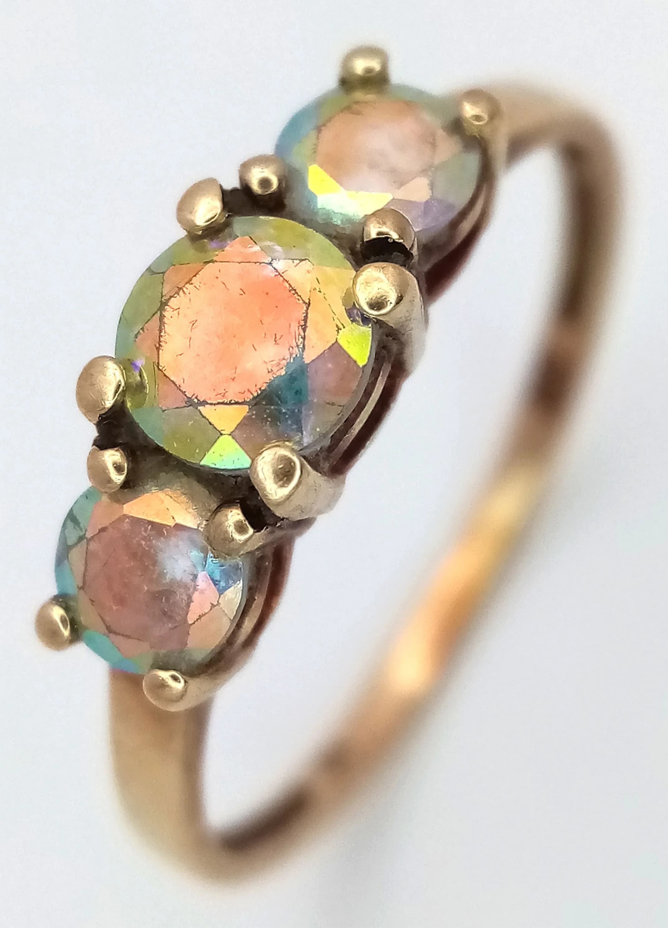 A 9K Yellow Gold Three Stone Ring. Size P. 1.5g total weight.