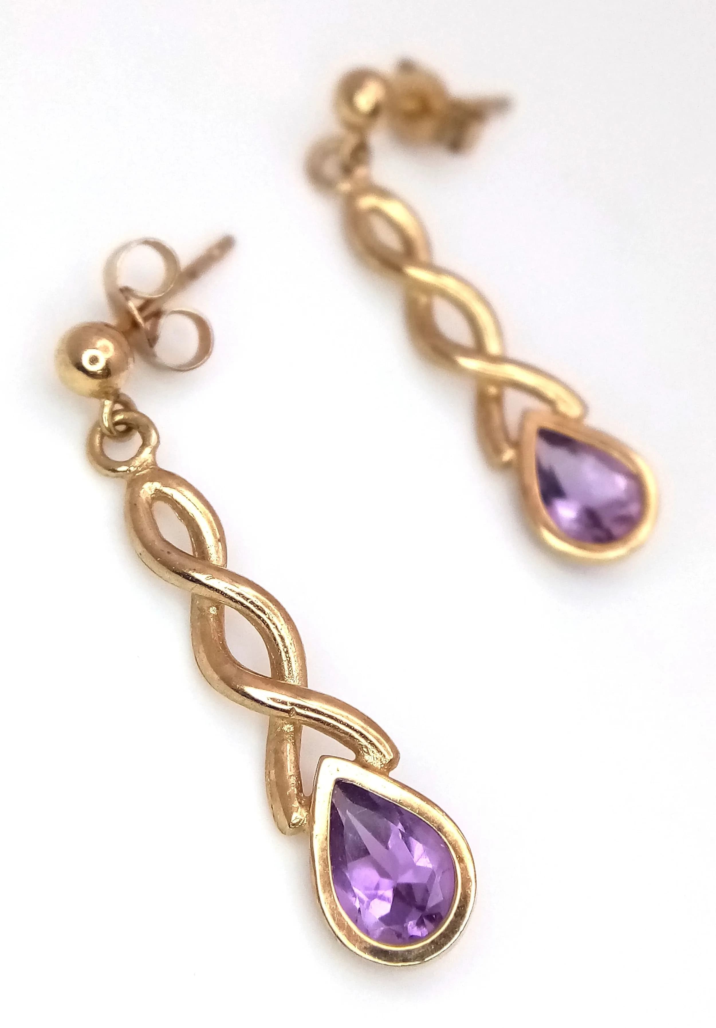 A Pair of 9K Yellow Gold and Amethyst Drop Earrings. 2.5cm. 1.9g total weight.