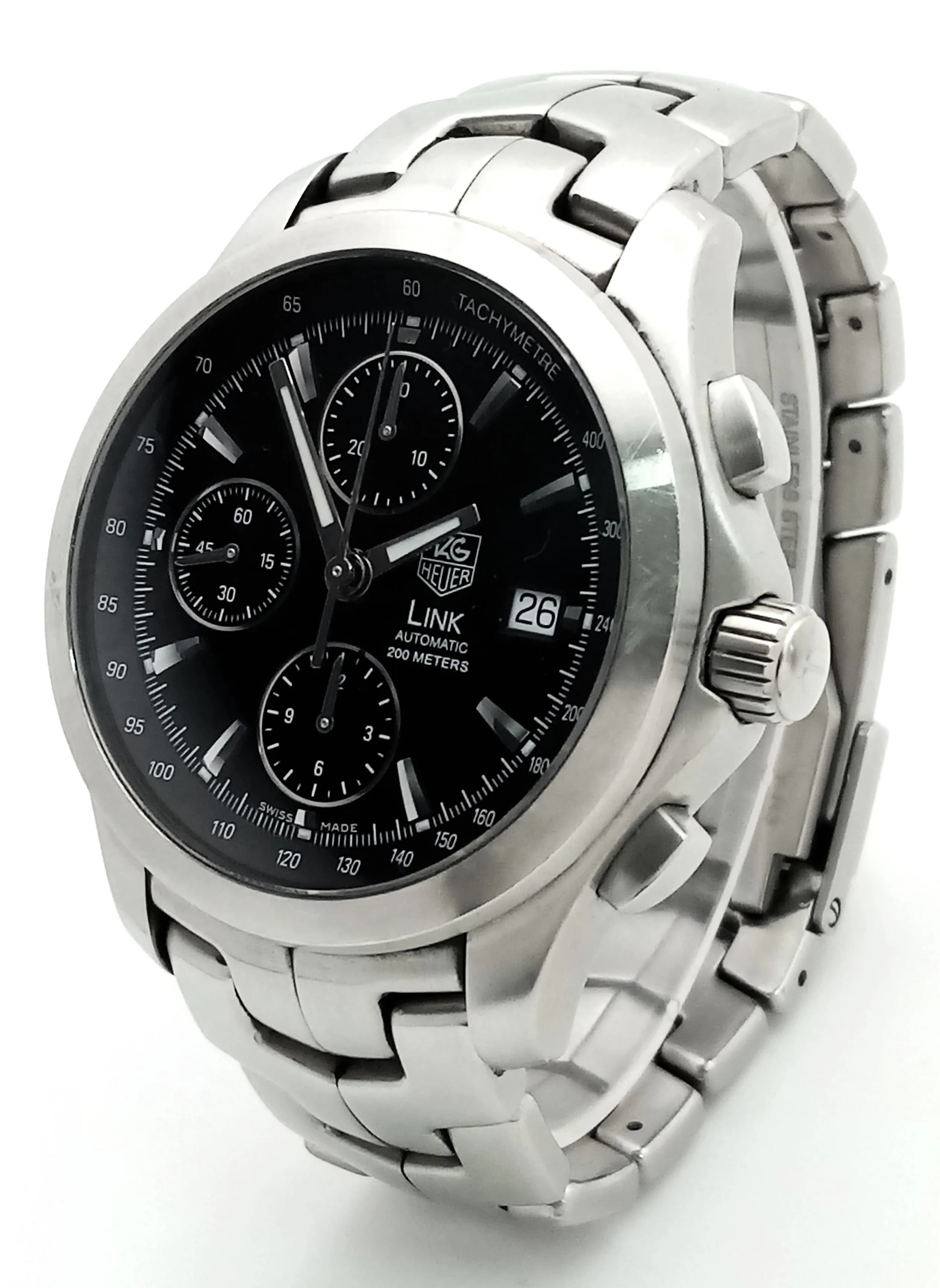 A Tag Heuer Link Automatic Chronograph Gents Watch. Model CJF2110. Stainless steel bracelet and case - 42mm. Black dial with three sub dials. In working order. Comes with box, spare links and papers. Ref: 029412.