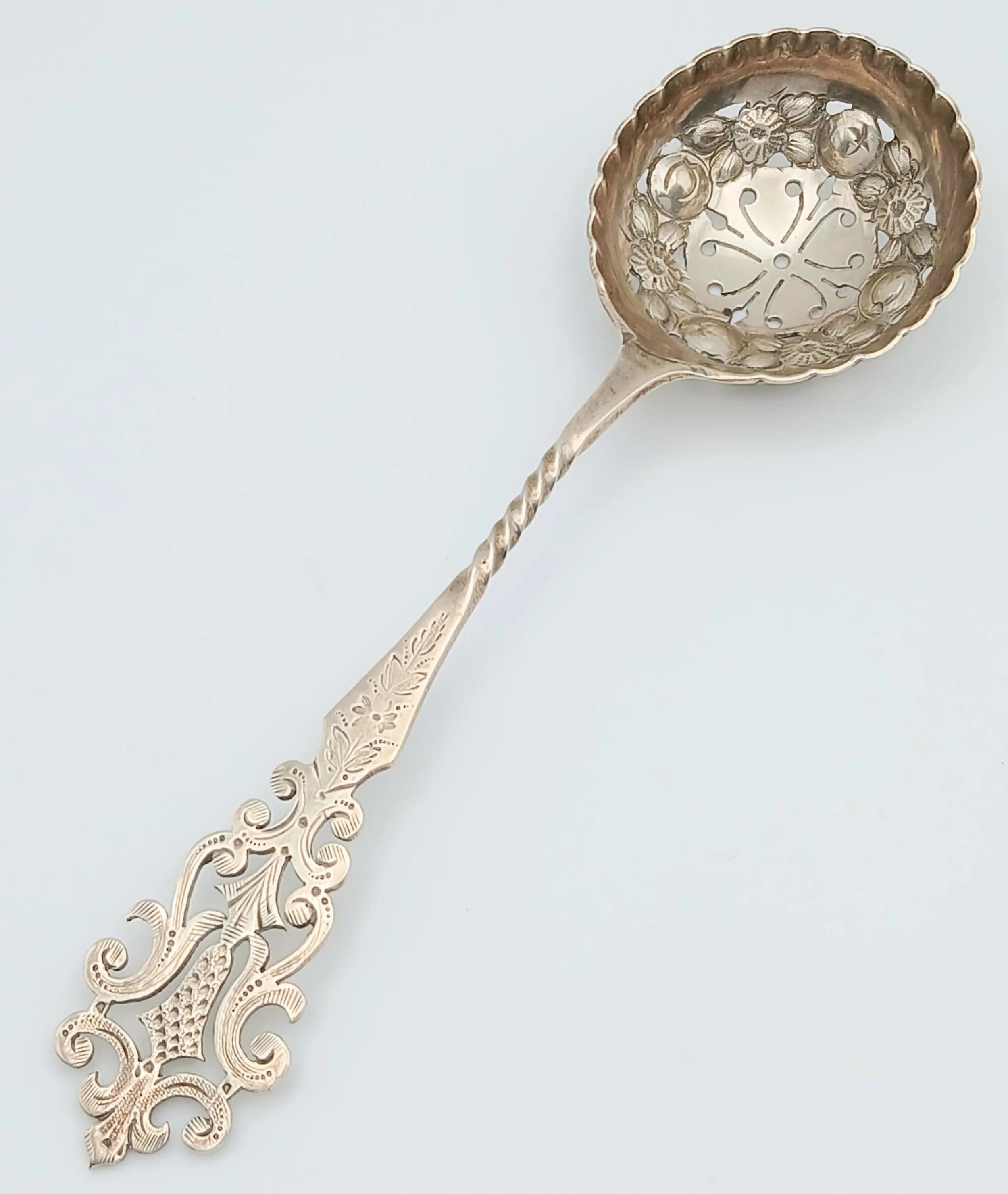 Antique SILVER SIFTING SPOON having exceptional raised detail to bowl. Beautiful Ornate handle and Finial. Clear hallmark for S. G. Jacobs , Birmingham 1913. Approx 26.6 Grams. 14 cm. Excellent condition, please see pictures.