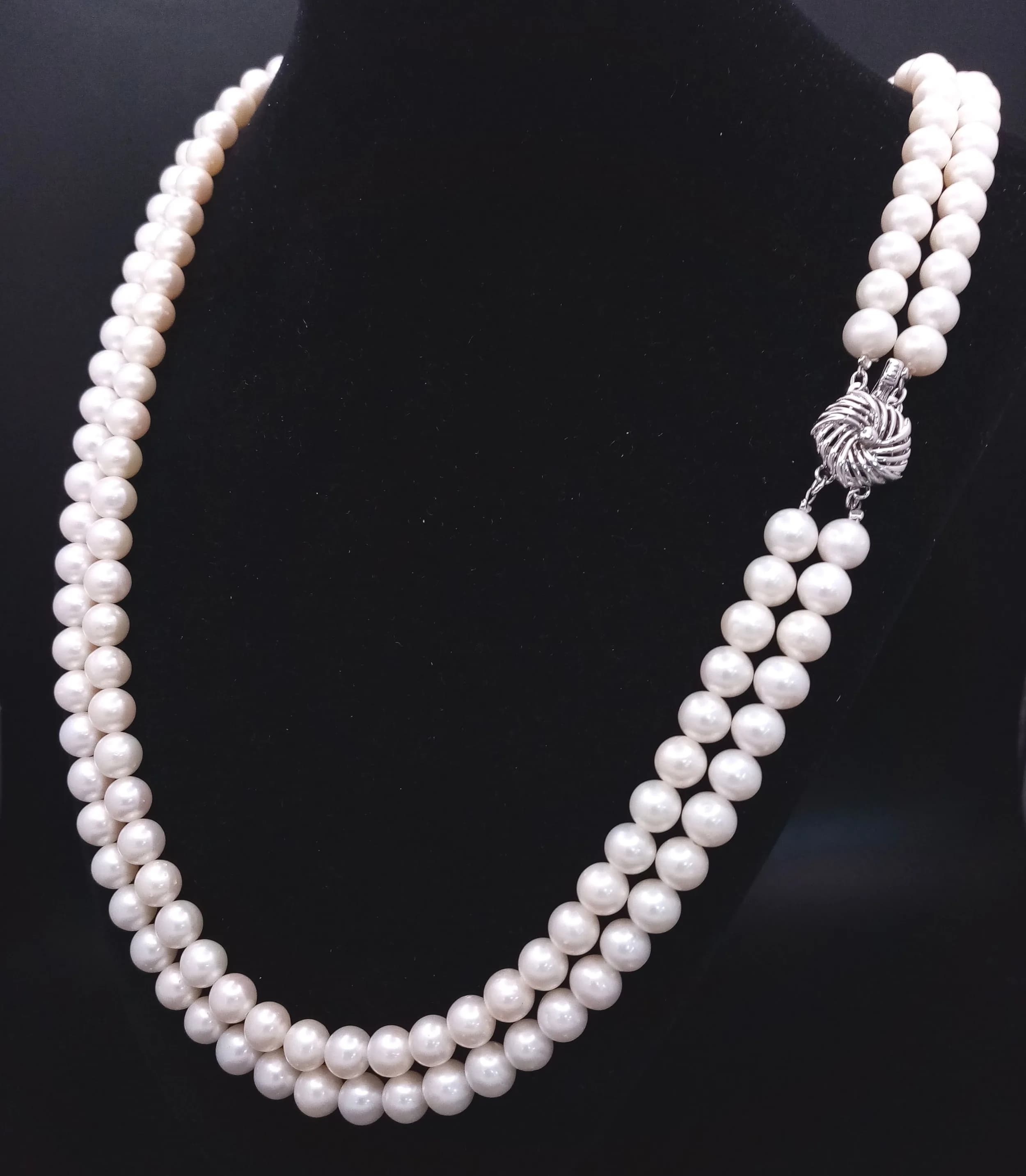 A gorgeous Double Strand Freshwater Pearl Necklace. Fitted with Silver floral decorative Box Clasp. Approx. 59cm in Length.
