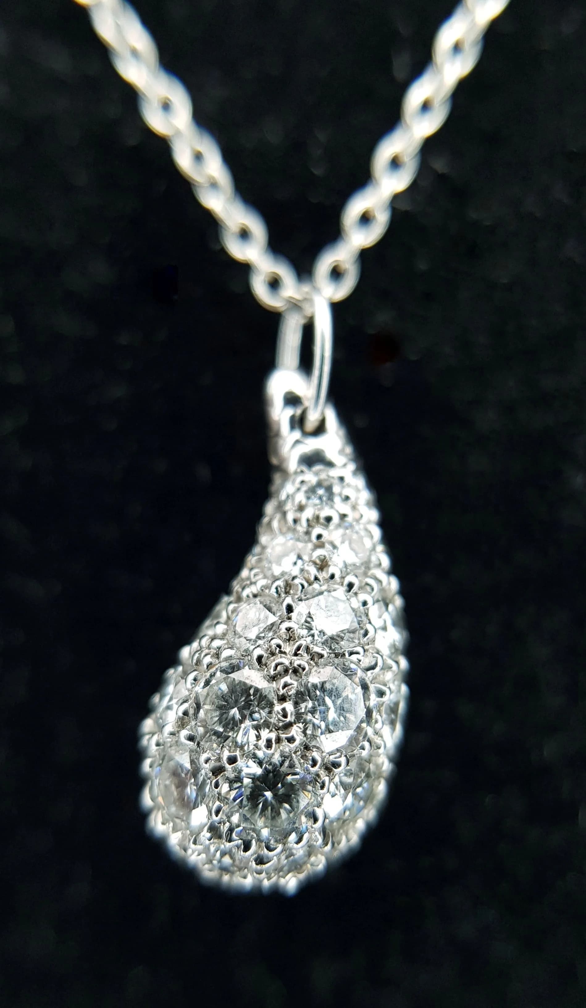 A Tiffany and Co. Elsa Peretti, 950 Platinum and Diamond Teardrop Pendant on a 950 Platinum Chain Necklace. A beautiful diamond encrusted teardrop from the Peretti and Tiffany collaboration. 2cm pendant. 42cm chain necklace. 4.9g total weight. Ref: 018133.