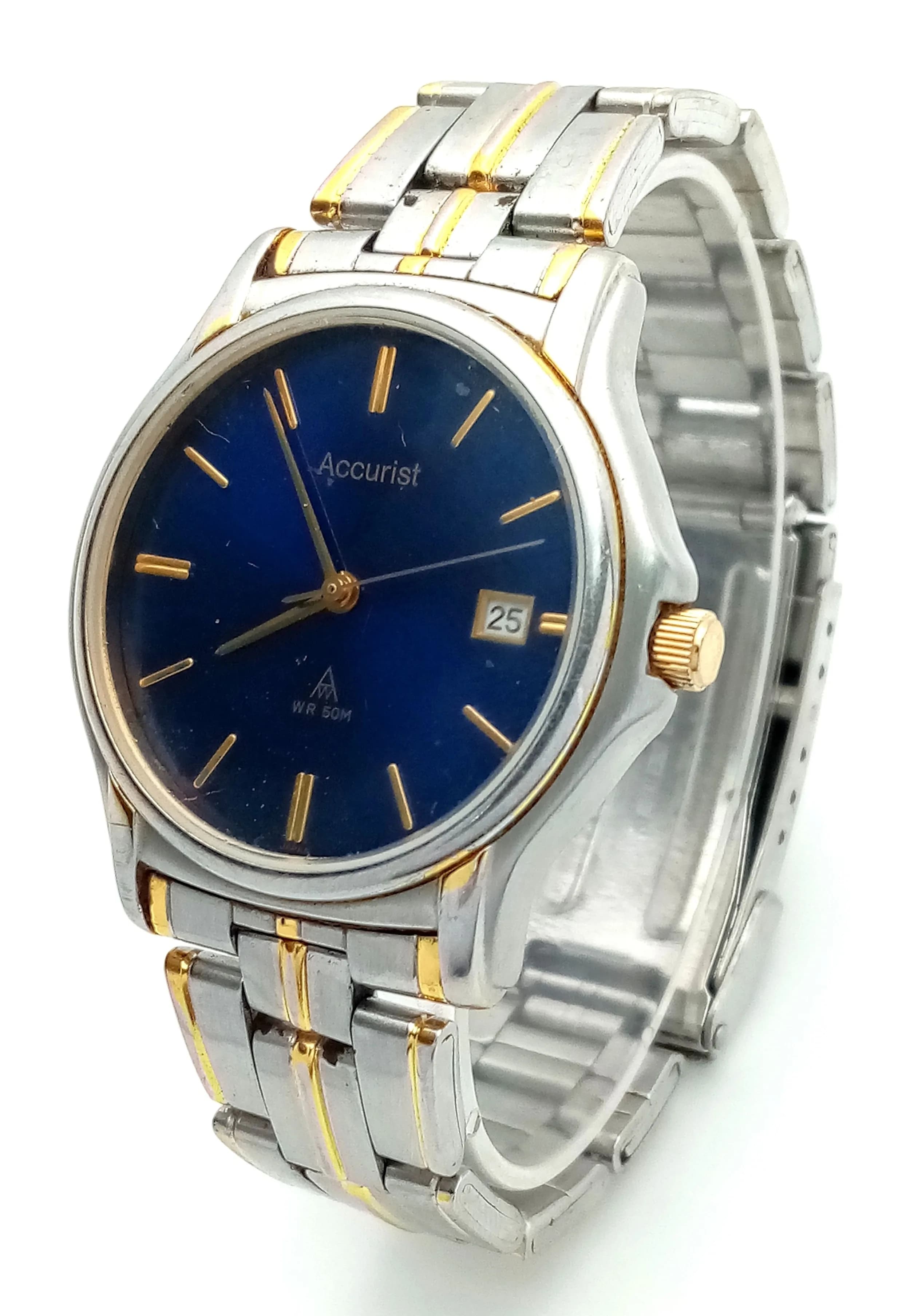 AN ACCURIST, 2 TONE, BLUE DIAL, DATE FUNCTION, BRACELET WATCH. IN FULL WORKING ORDER. NEW BATTERY FITTED RECENTLY. S/A 1702 - 4