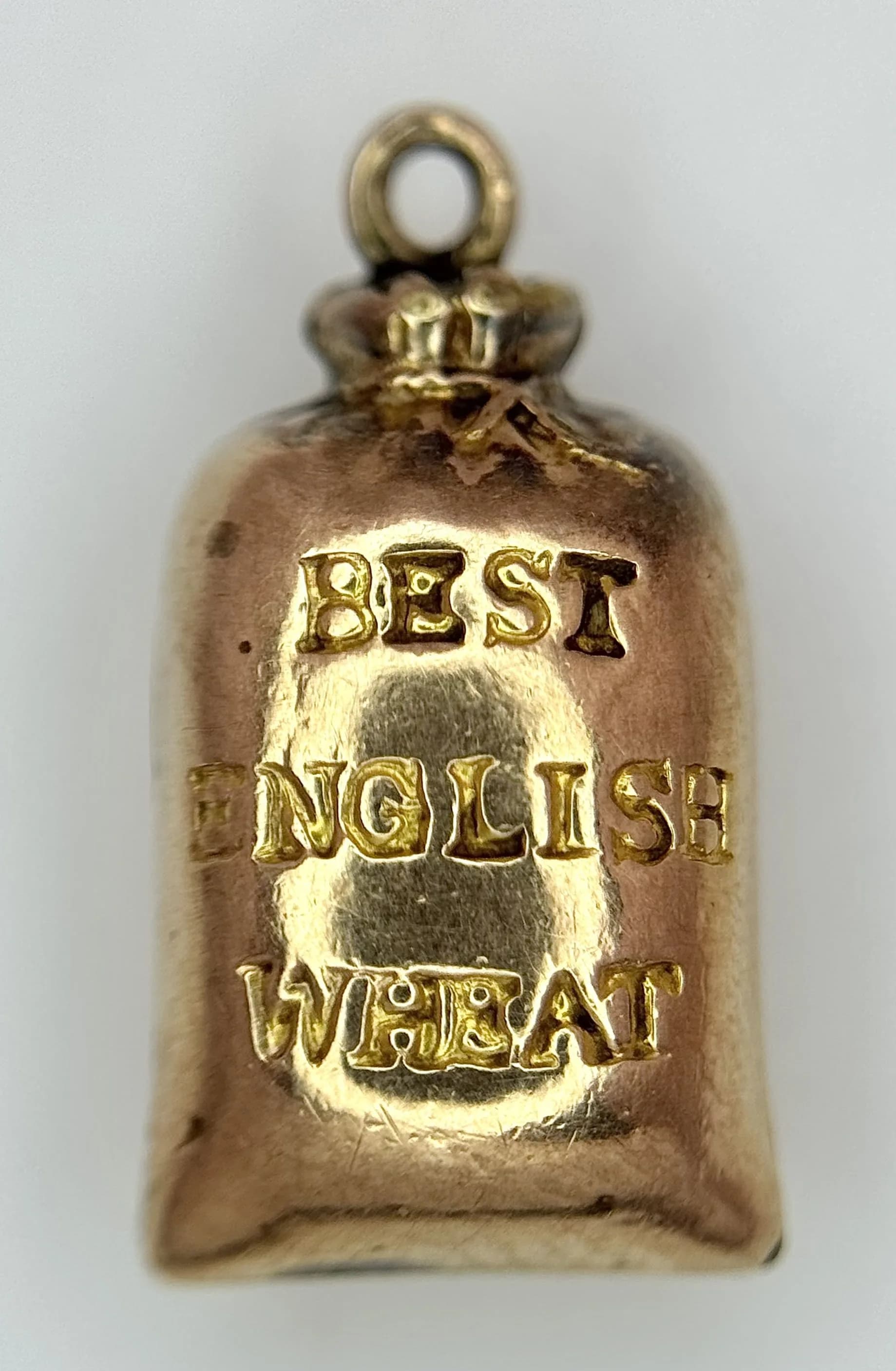 A 9k Vintage Gold 'Best English Wheat' Grain Sack Pendant/Charm. 15mm. 1.1g.