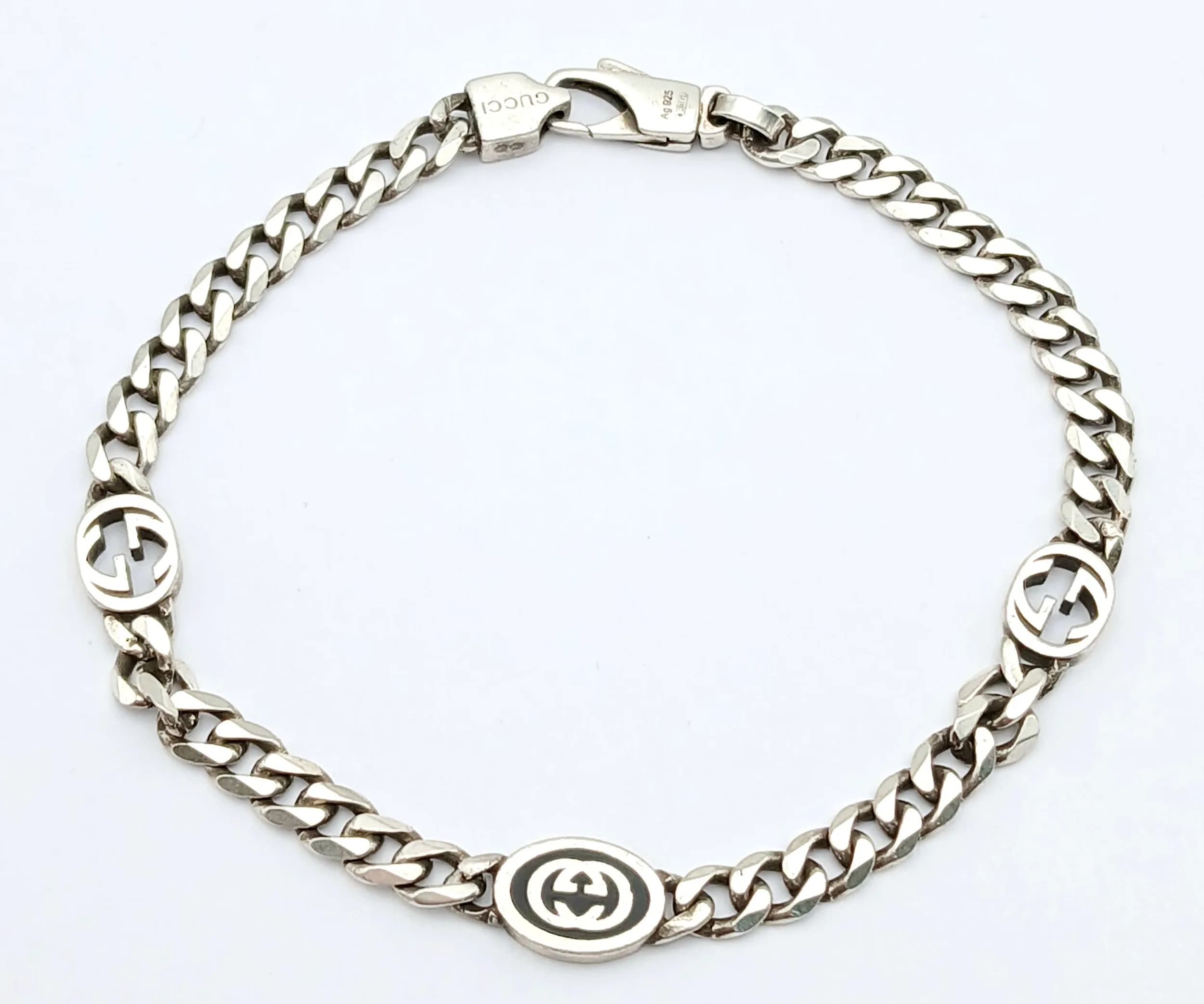 A Sterling Silver Gucci Accessory Bracelet with Gucci Monogram Spacers. 18cm. 8.25g. Ref: 029553.