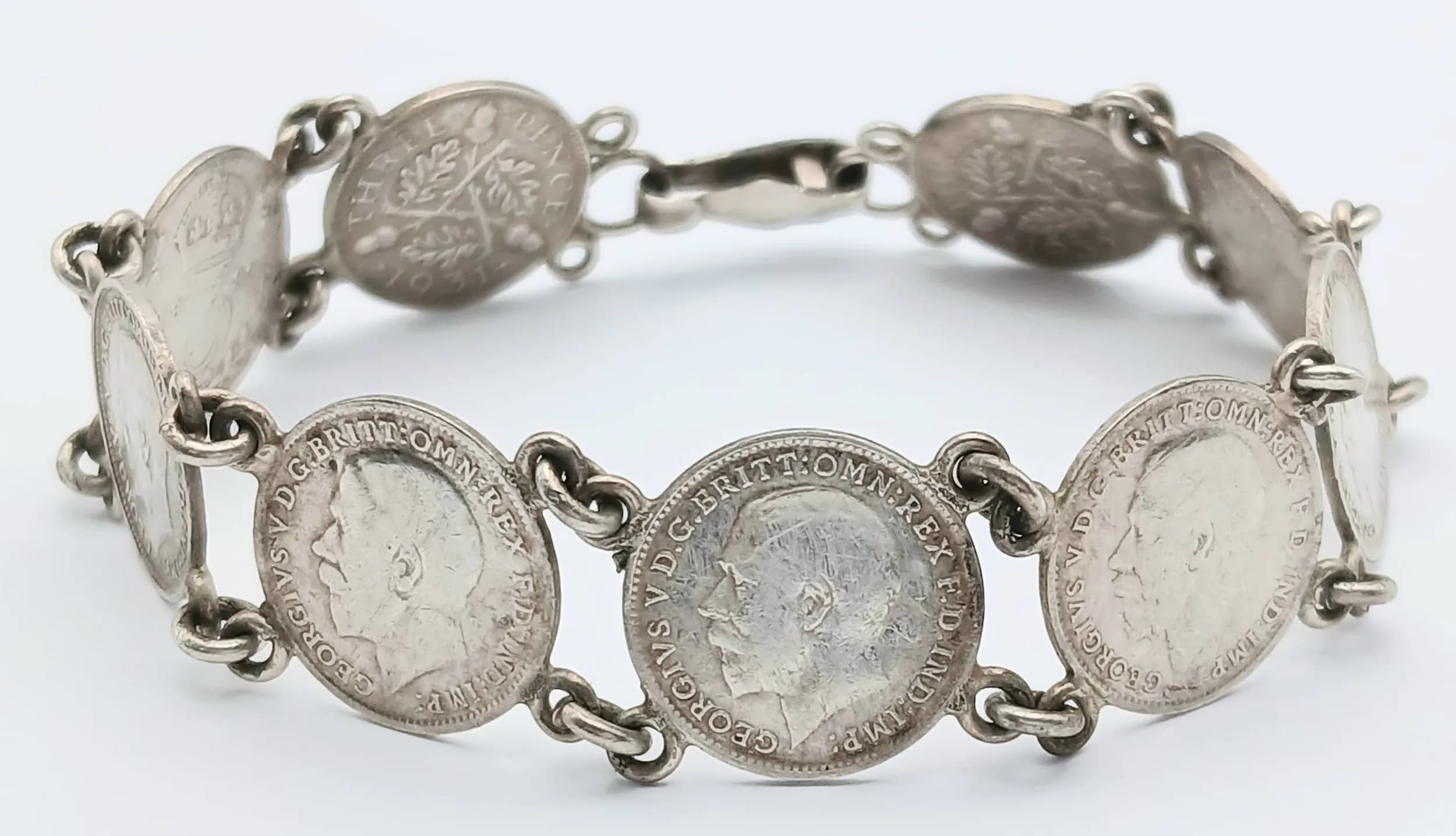 An Antique Silver Threepence Bracelet. All coins are pre 1920. 18cm. 17.55g