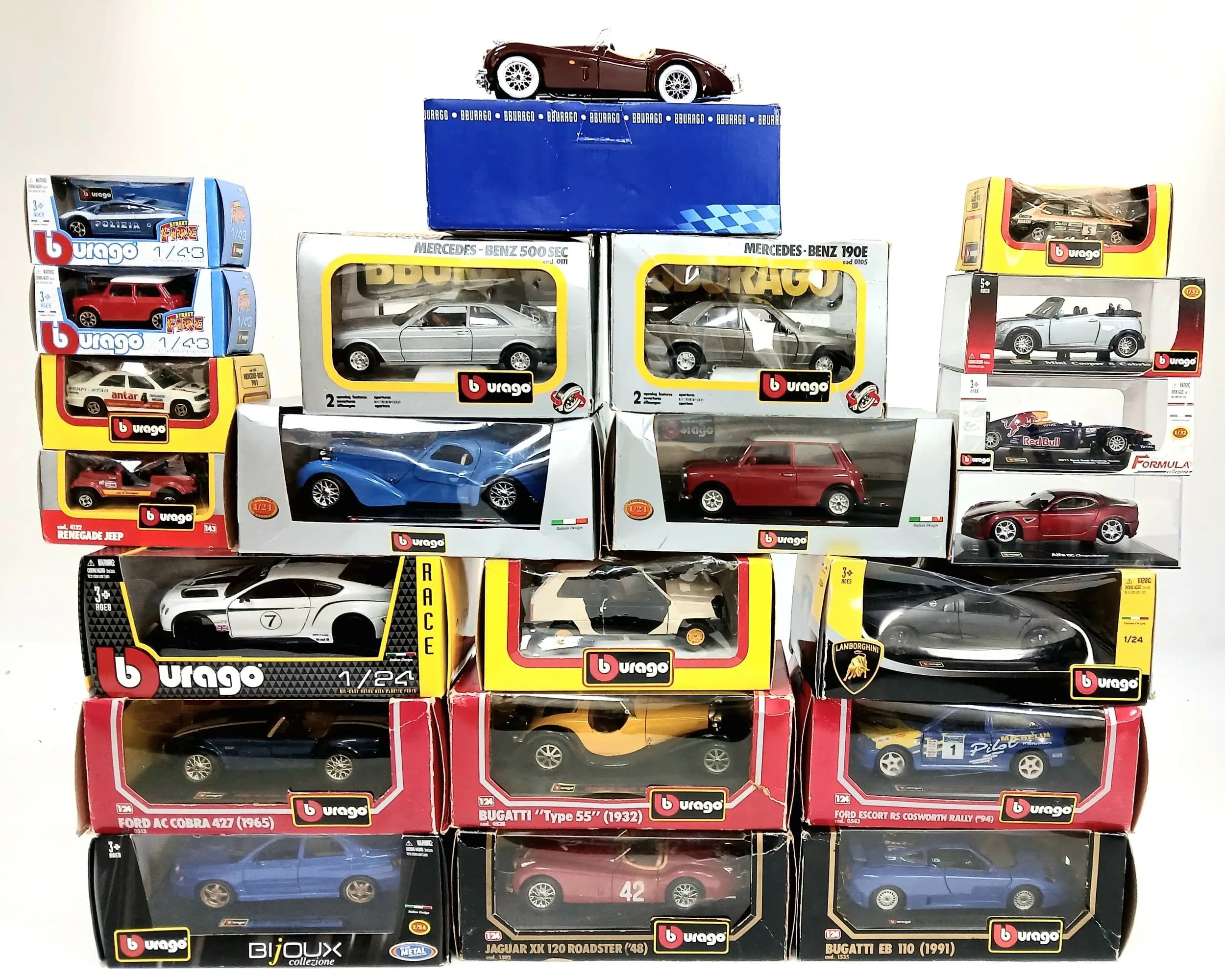 A collection of 22 die cast cars by Burago. 1/43, 1/32 & 1/18th scale. Models in good condition but some the boxes have wear from storage.