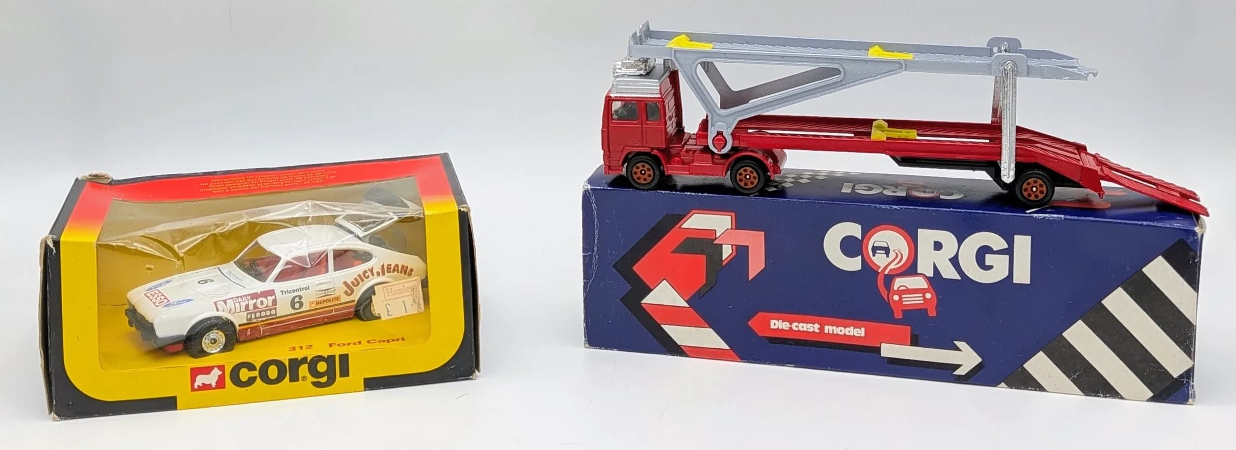 Two vintage, boxed Corgi models. A Ford Capri & a Volvo Globetrotter car transporter.