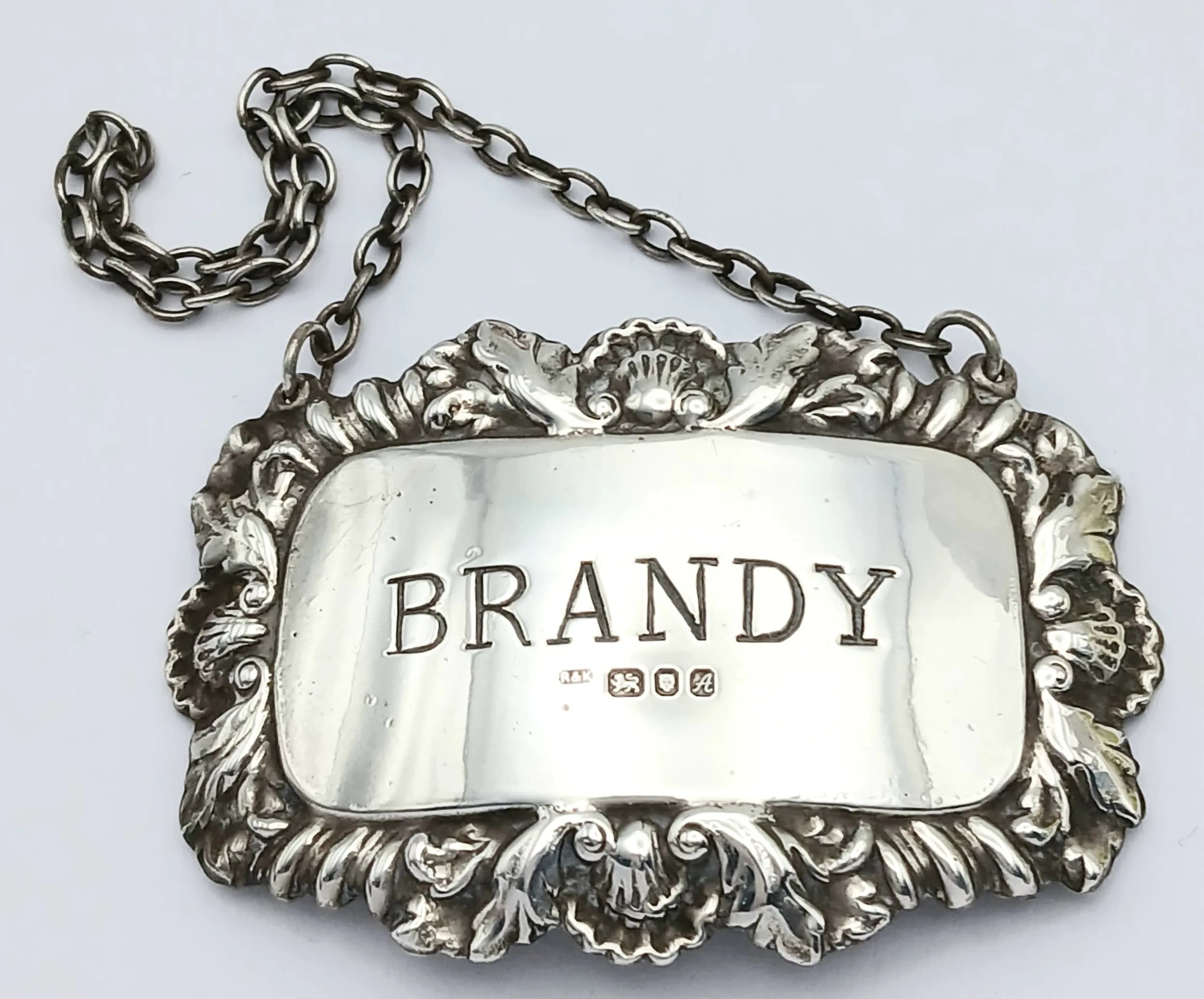 Vintage Fully Hallmarked SILVER DECANTER LABEL for BRANDY. Attractive Shell and Leaf Surround. Please see pictures.