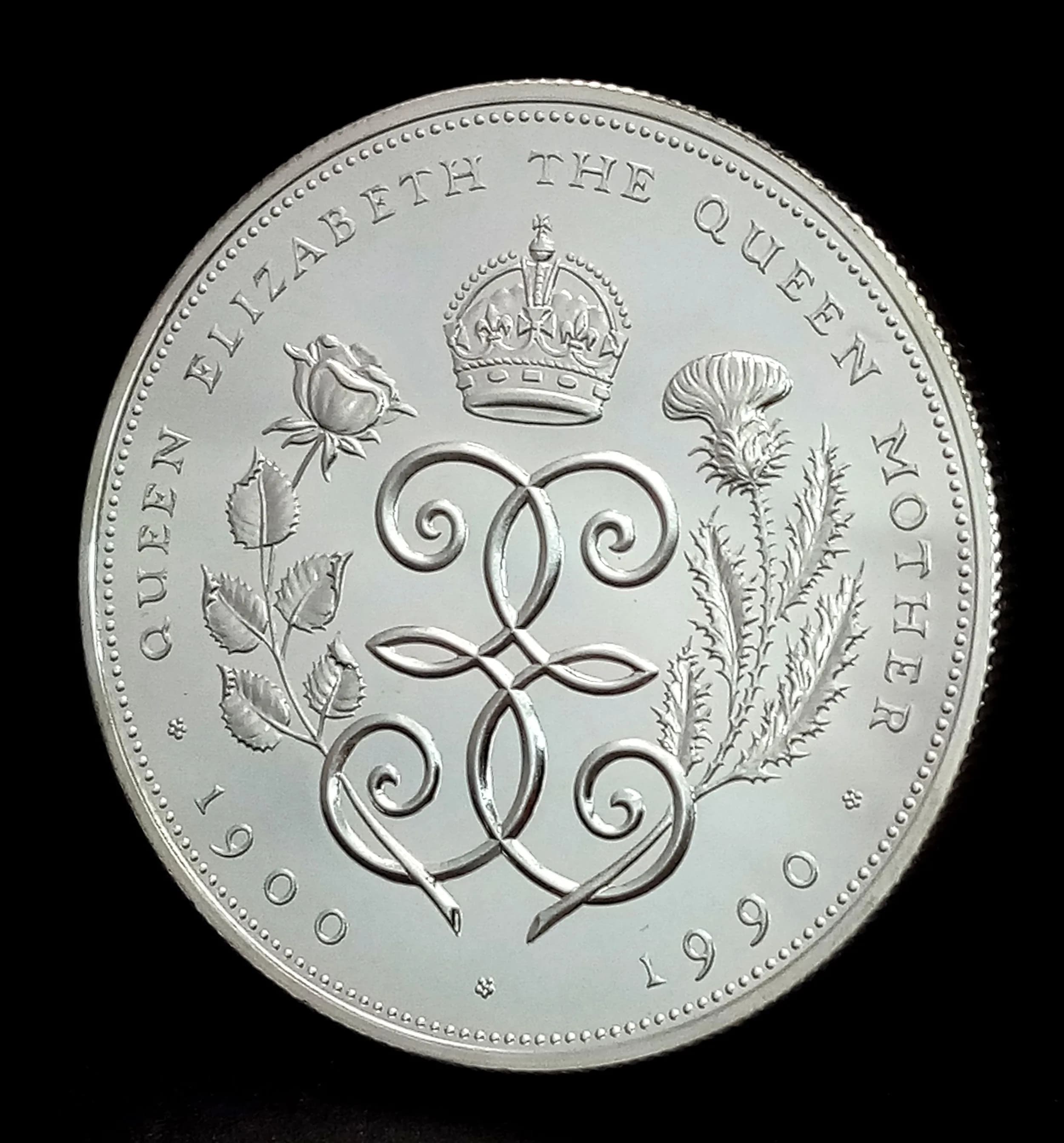 A Royal Mint 90th Birthday Sterling Silver Proof Crown Coin. Encapsulated with COA and case. 28.28g.