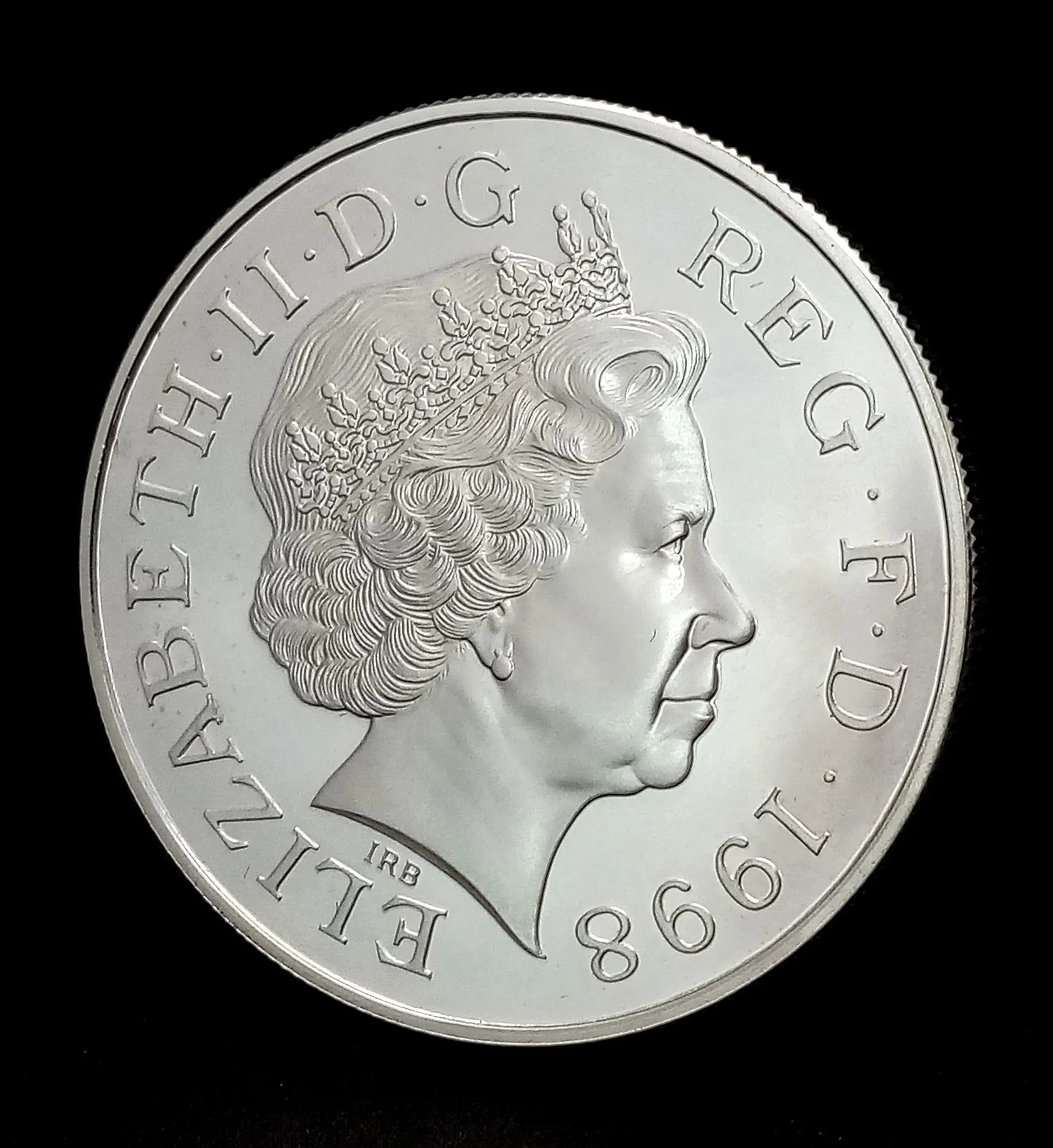 A Royal Mint 1998 United Kingdom Prince of Wales 50th Birthday Silver Proof Crown Coin. Encapsulated with COA and case. 28.28g.