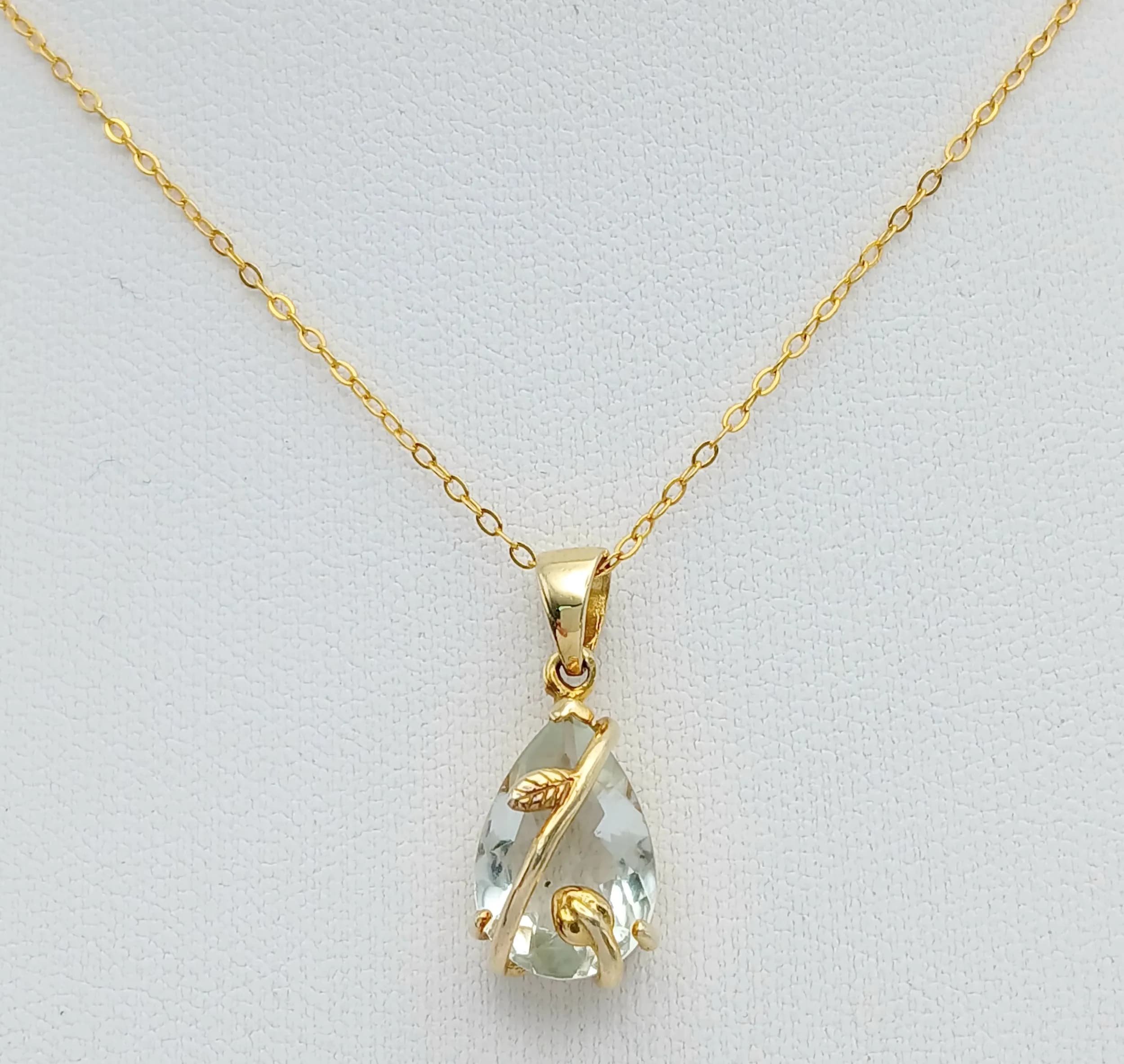 A Gold Gilded Sterling Silver Aquamarine Set Pendant Necklace-41cm Length Chain. Set with a 14 x 9mm Tear Drop Cut Aquamarine, approximately 4 Carat. Gross Weight 2.87 grams.