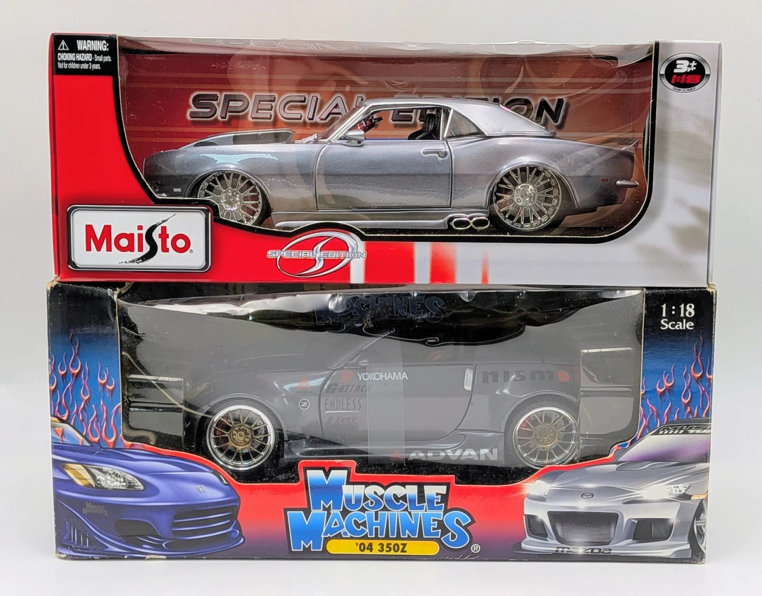 Two 1/18th die cast cars by Muscle Machines & Maitso. Good condition. Very slight wear to boxes fromstorage.