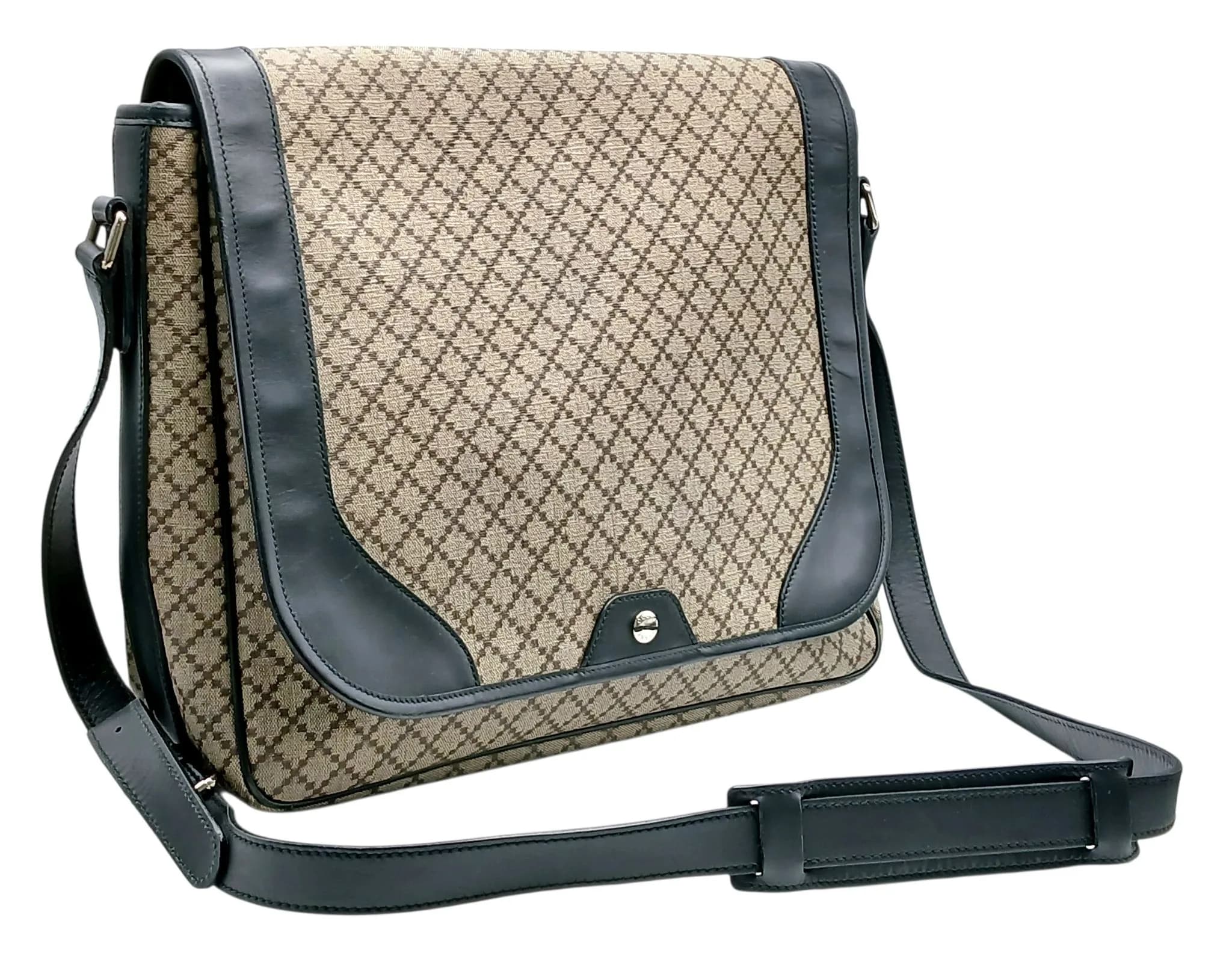 A Gucci Diamante Messenger Bag. Beige and brown Diamante canvas exterior with adjustable black leather shoulder strap, silver-toned hardware and magnetic closure. Beige textile interior with one zipped pocket and slip pockets. Approx. 39cm length x 30cm height x 10cm depth. Some signs of wear, marks and scratches to the exterior and interior. Please see photos or request a condition report. Ref: 29345.