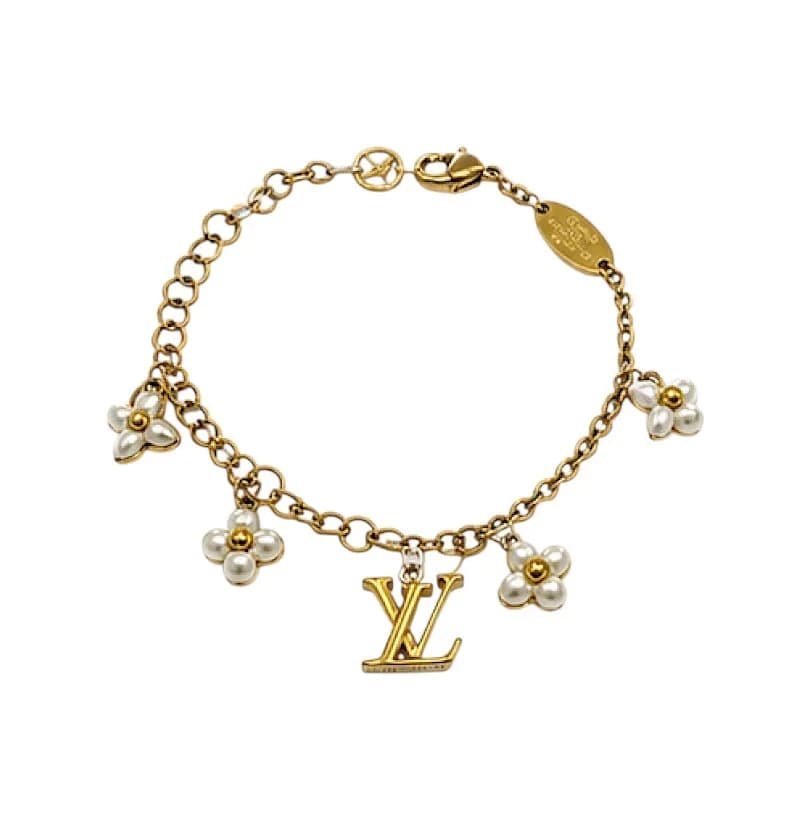 The LV Floragram Bracelet. Monogram Flowers hang from the first row of the bracelet, while an LV Initials charm on the second row. Adjustable. Approx Length: 20 cm, weight: 5.9 g. Come with Dust Bag.