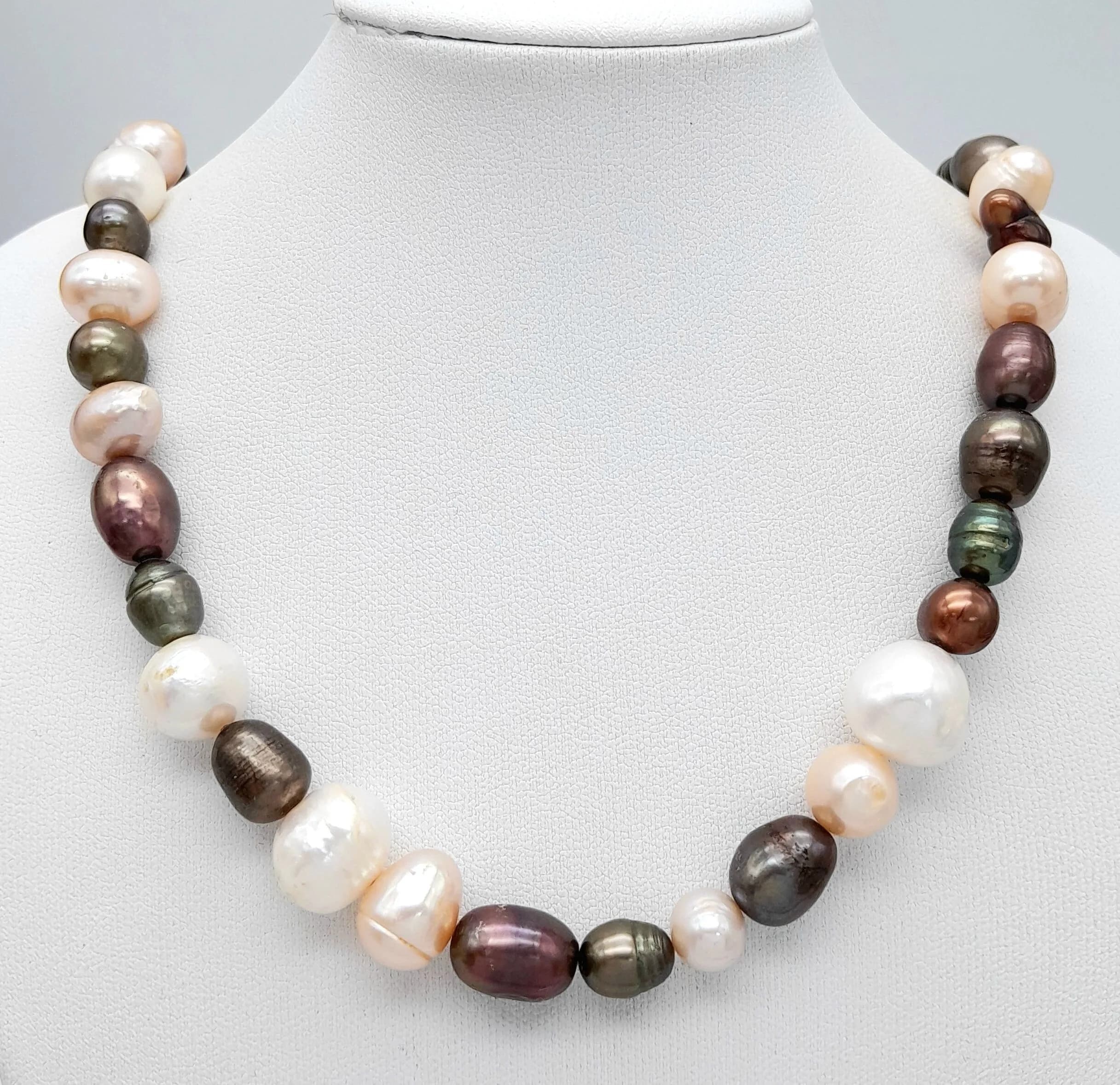 A Vintage Sterling Silver Multi-Colour Pearl Necklace-44cm Length. Pearls range in size from 6 to 13mm Widths. Gross weight 51.35 grams.