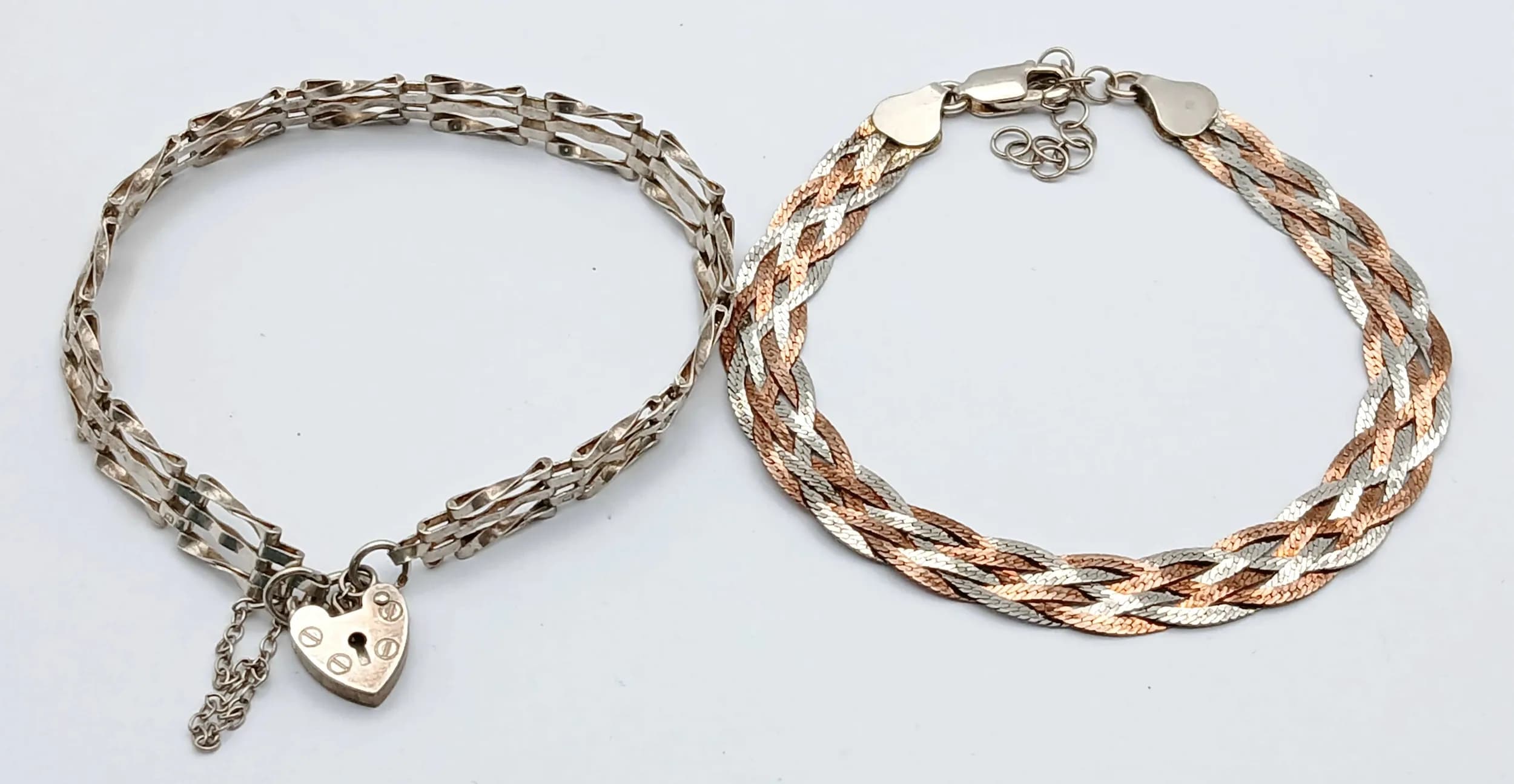 A Vintage SILVER GATE BRACELET (18 cm) with Safety Chain and Padlock Fastening Full UK hallmark. Together with a WOVEN SILVER BRACELET IN TWO TONE SILVER. (19 cm).