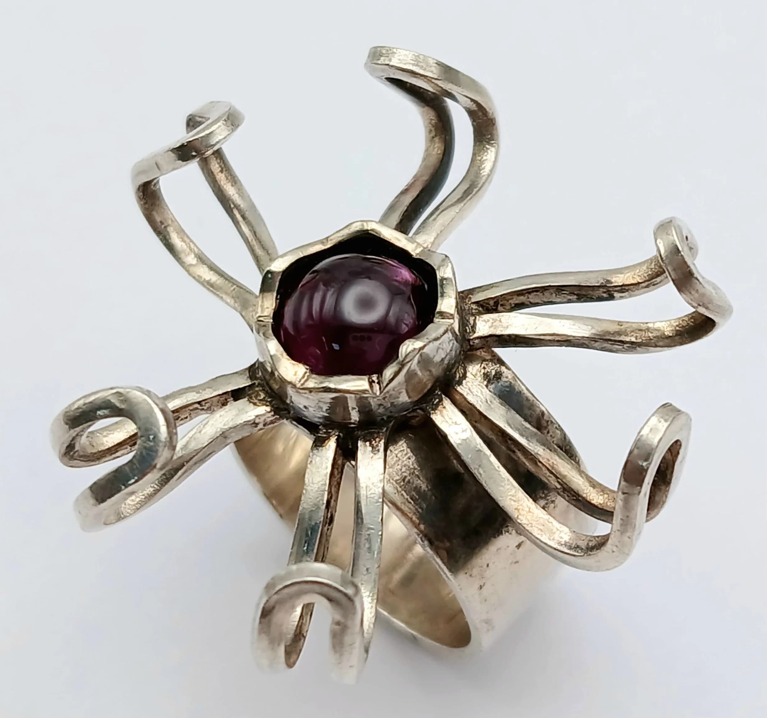 An Unique Sculptural Modernist Design Sterling Silver and Amethyst Petal or Sunburst Design Ring Size K. The Ring measures 3.3cm wide at the Crown and has a gross weight of 10 grams. London Hallmarked 1972/3 by JR Ogden and Sons.