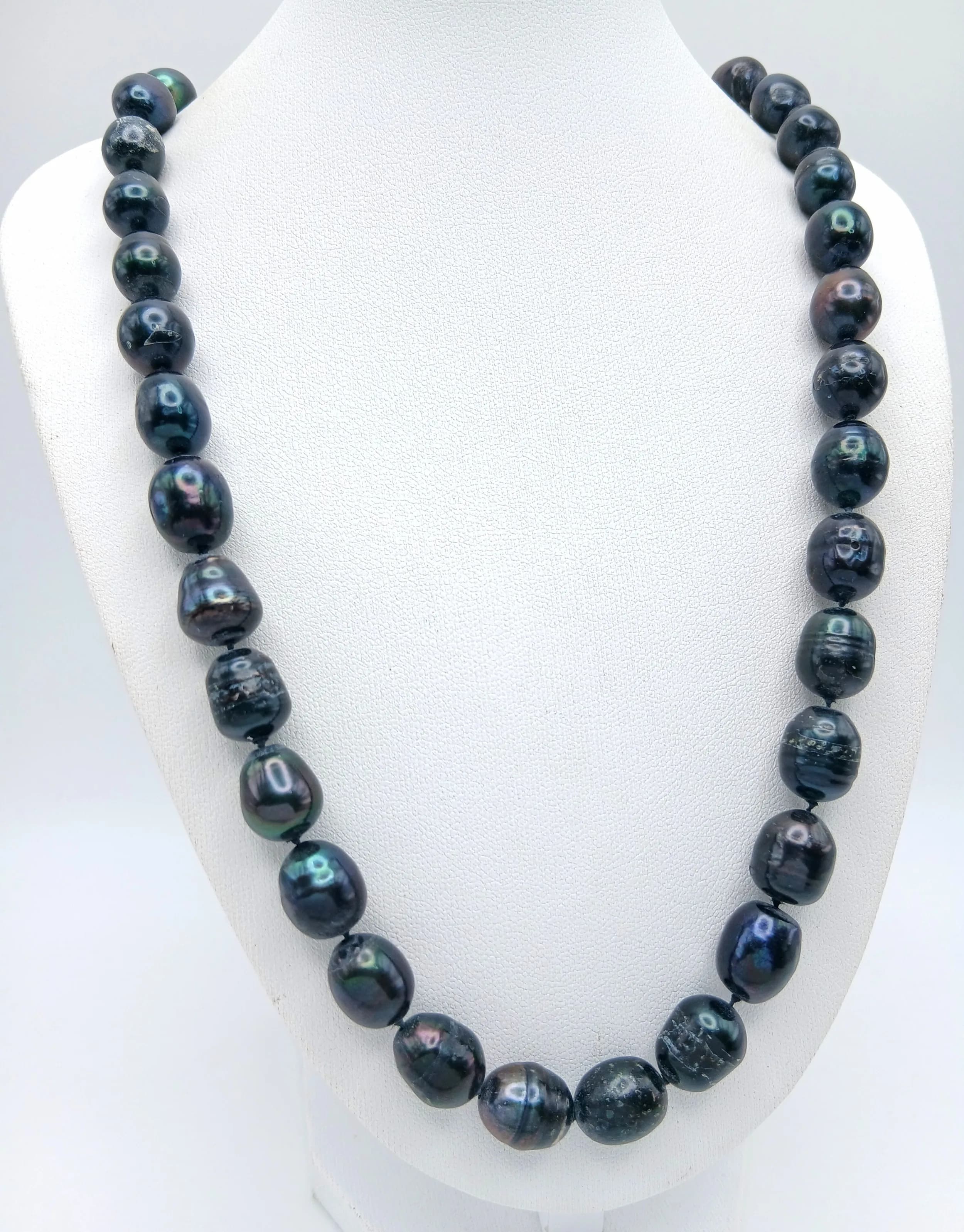 A Pretty Dark Freshwater Pearl Necklace – 48cm Length. Features a single strand of irregular black freshwater pearls with a 925 silver clasp. 10.5mm Pearls.