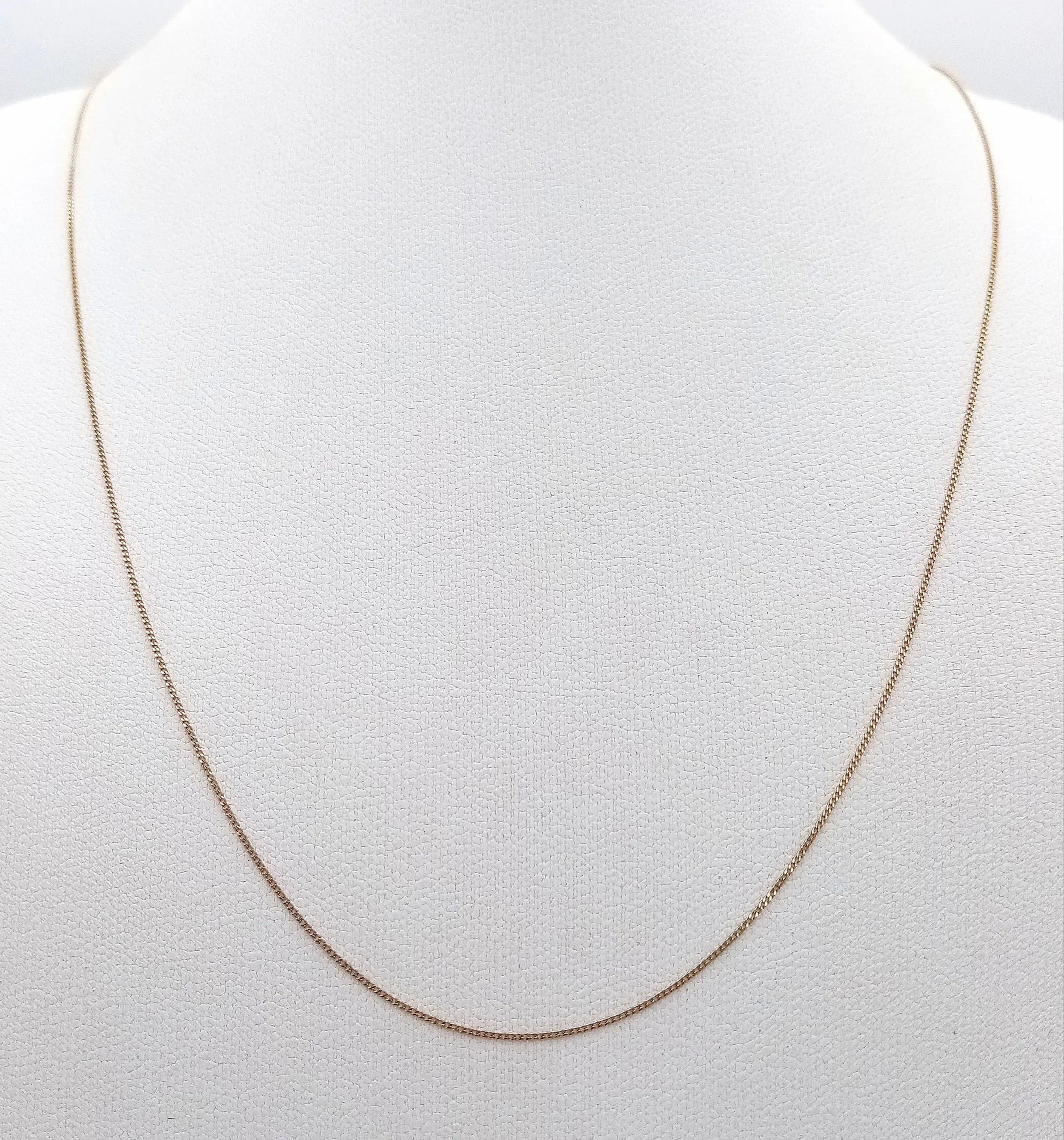 A 9K Yellow Gold Disappearing Necklace. 41cm length. 0.42g.