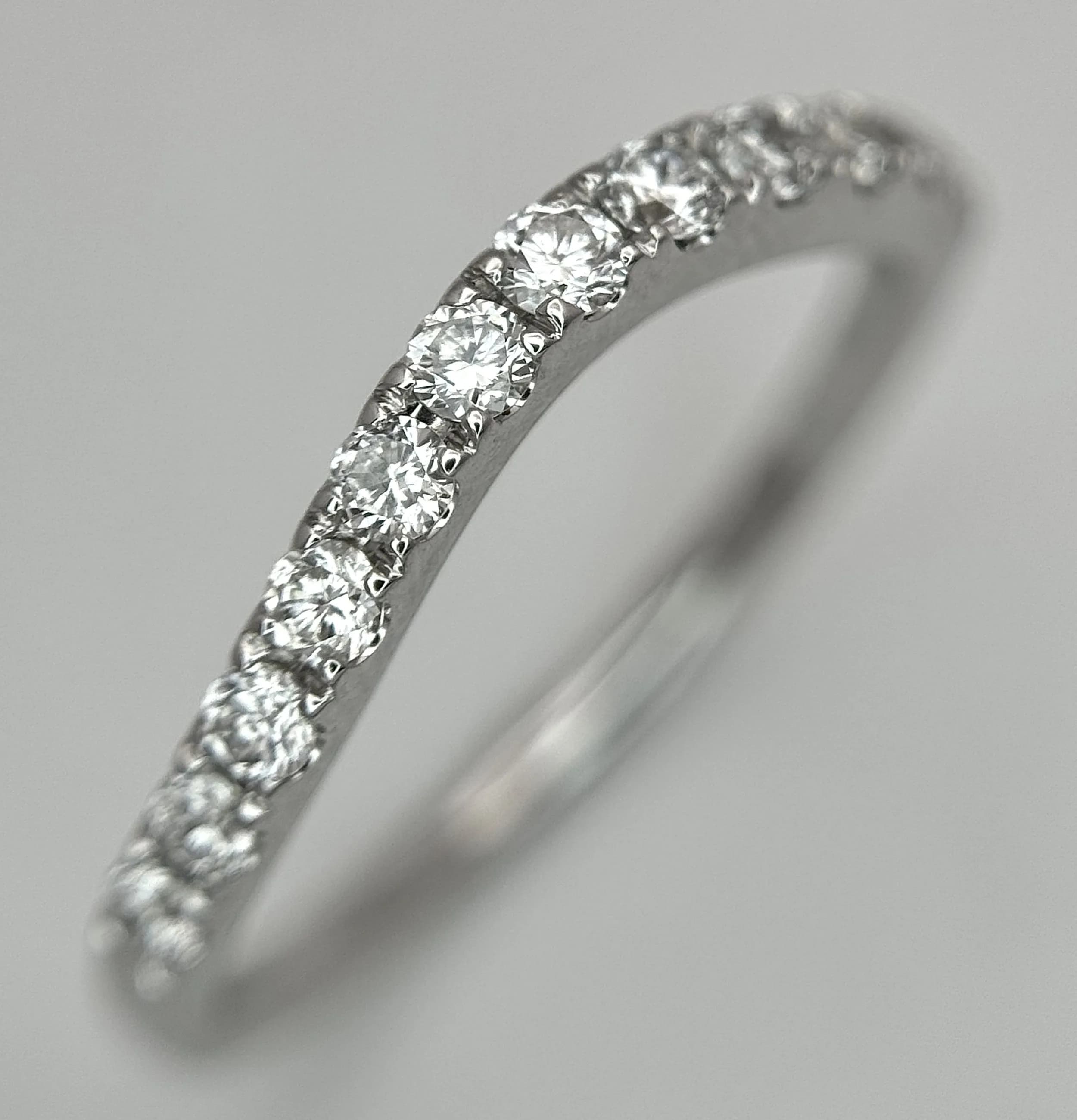 AN 18K WHITE GOLD, DIAMOND SET, SHAPED BAND RING. 0.33CTW. 2.2G, SIZE L. SC 6082