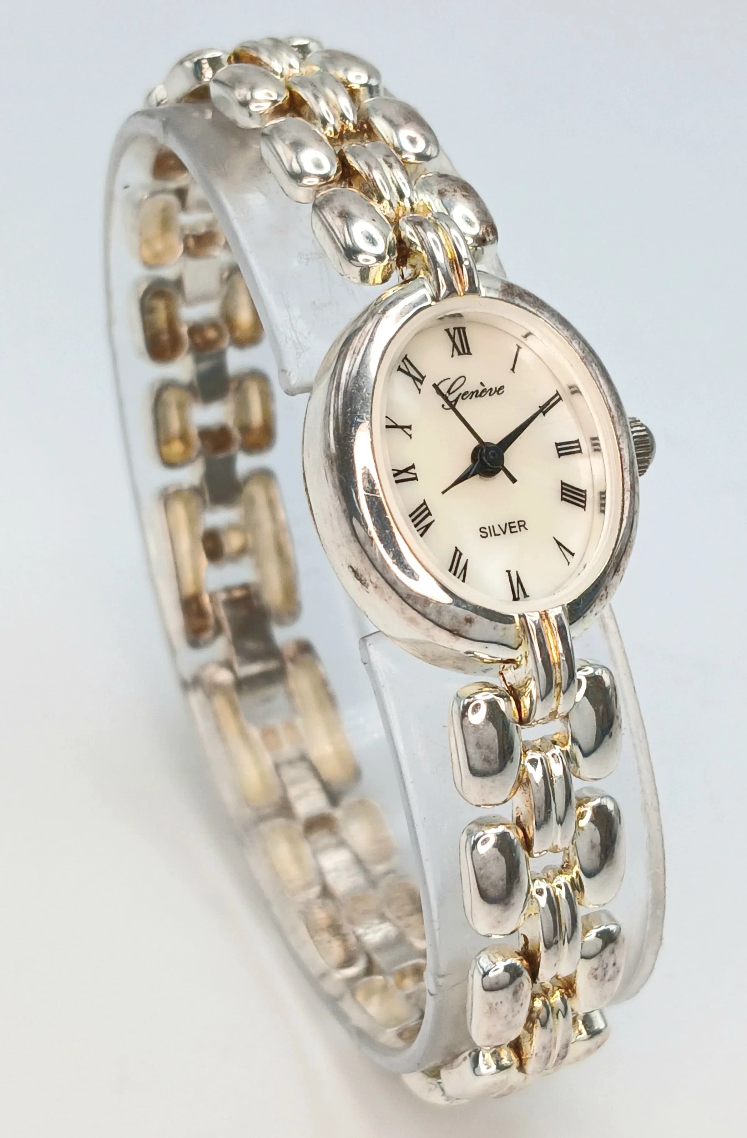 A Geneve 925 Silver Bracelet Watch. Mother of pearl dial and Roman numerals. 27.06g total weight.