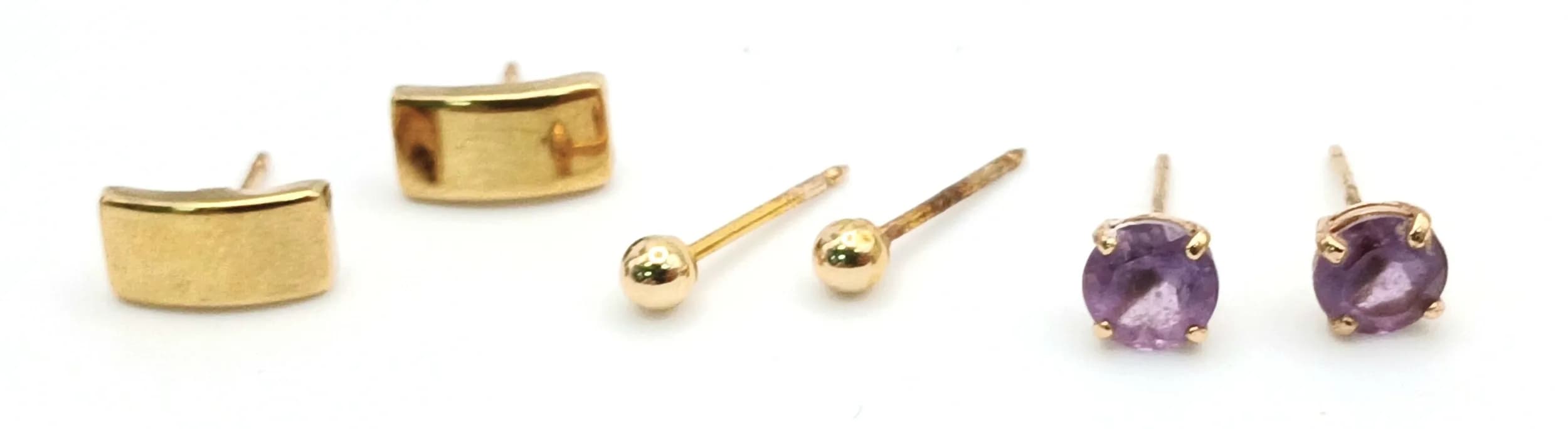 Three Different Style Pairs of 9K Gold Earrings. 1g total weight. No backs.