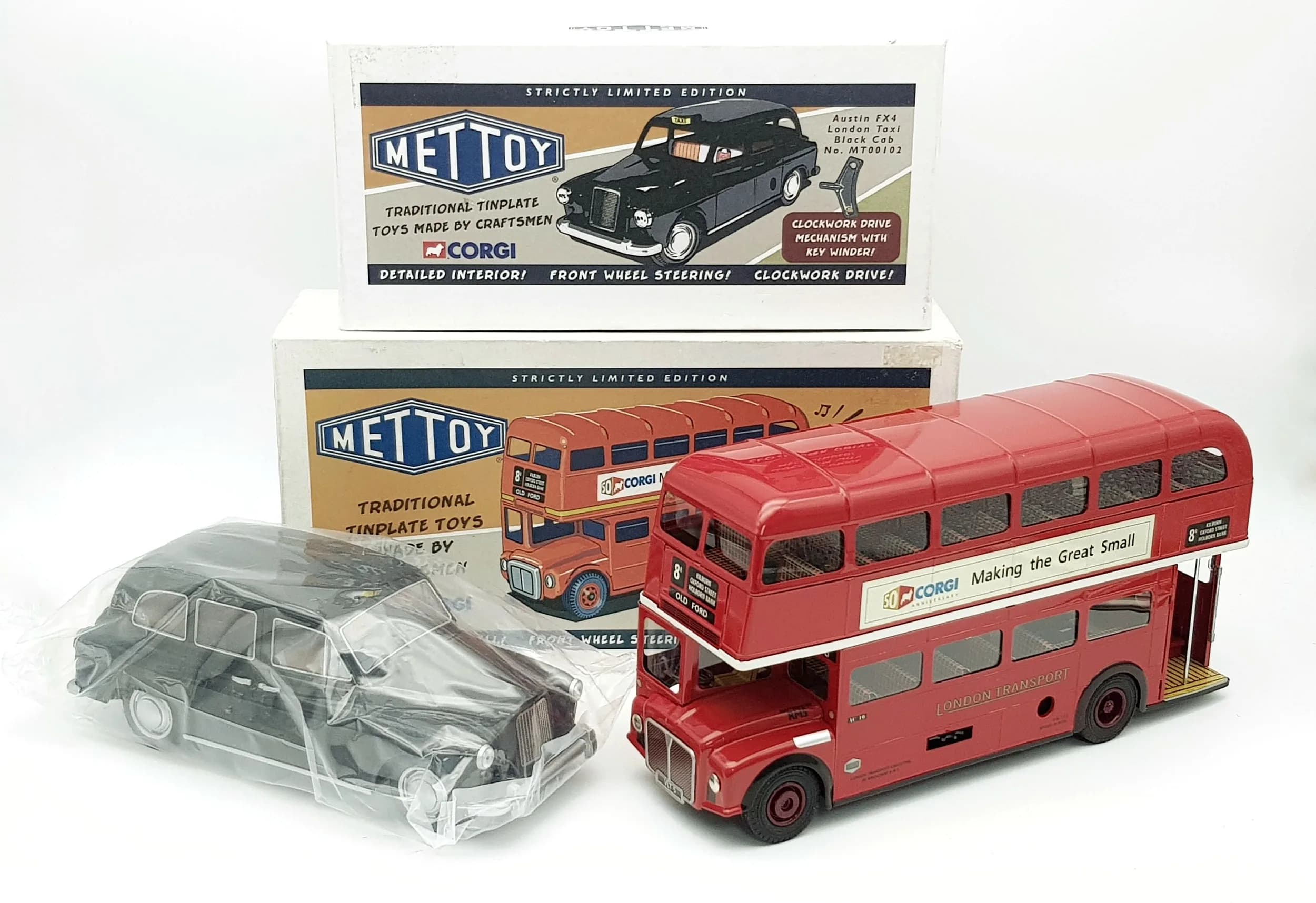 Two Corgi Mettoy clockwork tin plate toys. A London bus & taxi. In excellent condition.