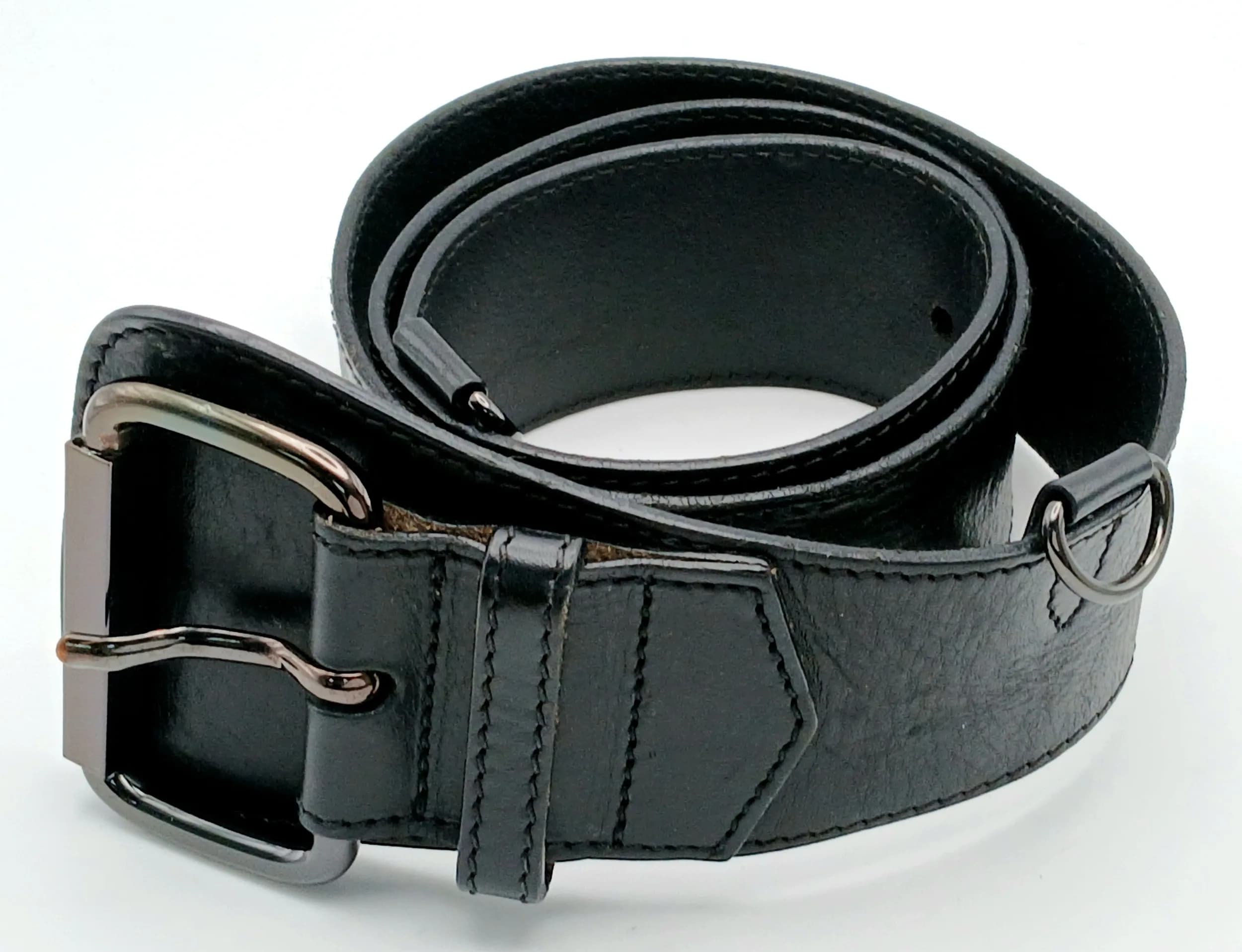 A Burberry Black Leather Wide Belt. Black leather construction with a polished gunmetal-tone buckle. Approx. 103cm length x 5cm width. Some signs of wear and scratches to the leather and hardware. Please see photos or request a condition report. Ref: 29423.