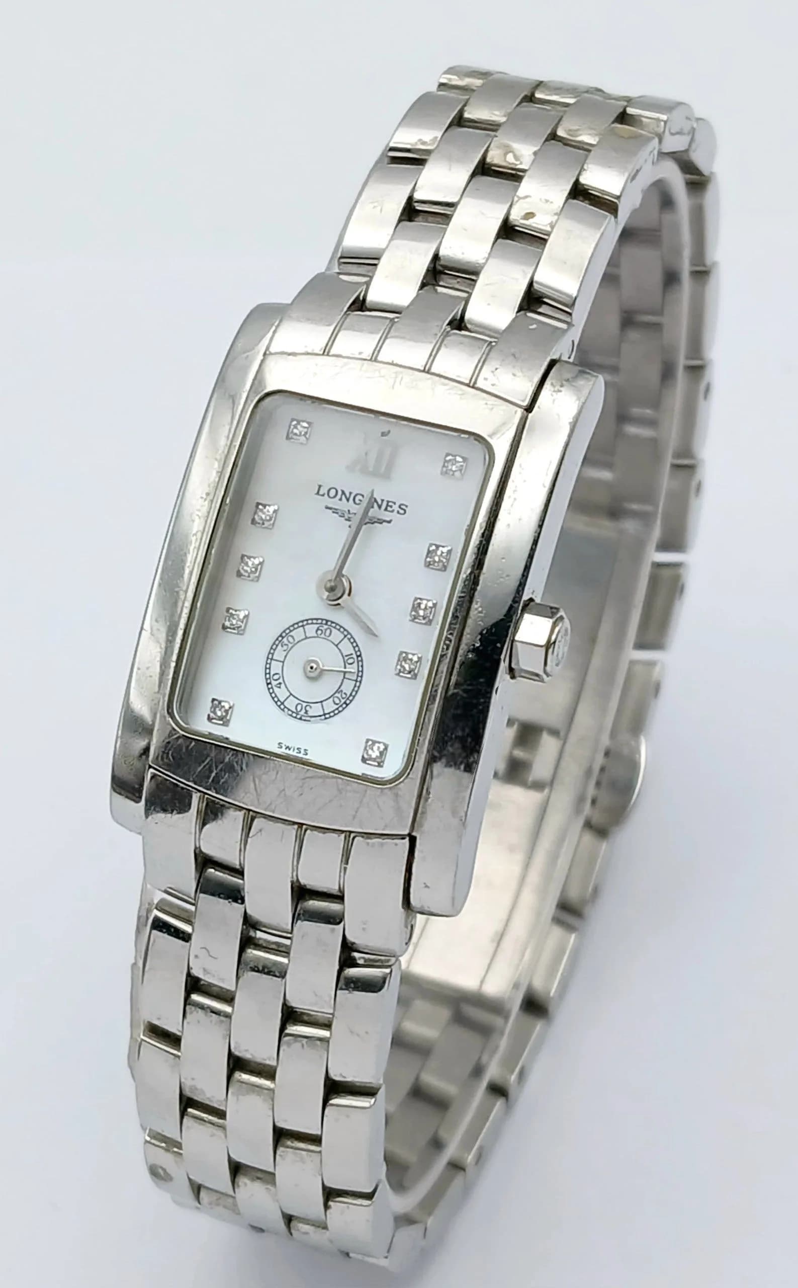 A Longines Dolce Vita, Mother of Pearl and Diamond Quartz Ladies Watch. Stainless steel bracelet and case - 20x 30mm. Mother of pearl dial with second sub dial and diamond markers. New battery recently fitted, in working order. Ref: 029283.