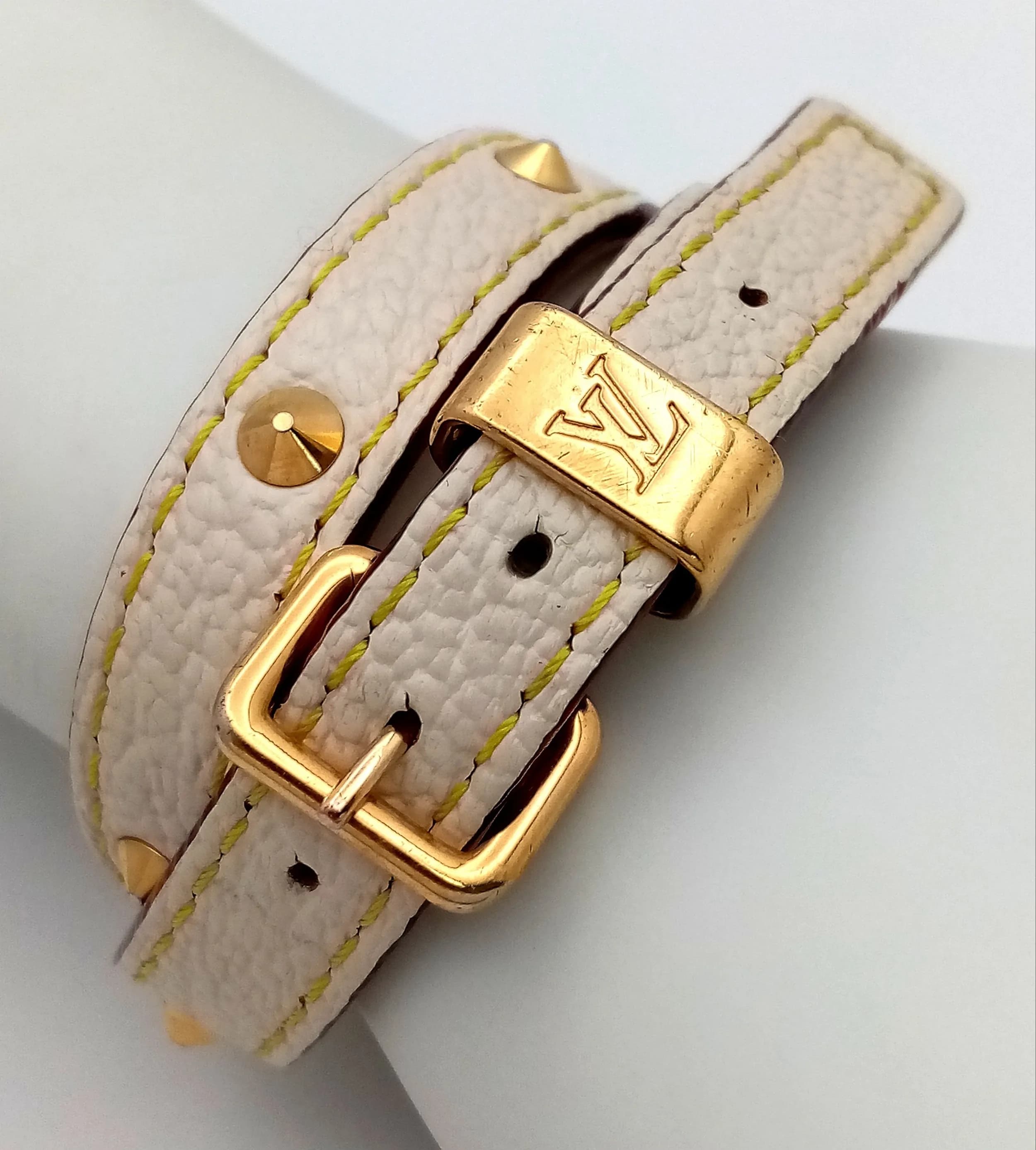 A Vintage Louis Vuitton Suhali Double Coiled Bracelet. Leather with gold-toned studs and buckle closure. Approximately 40.5cm length.