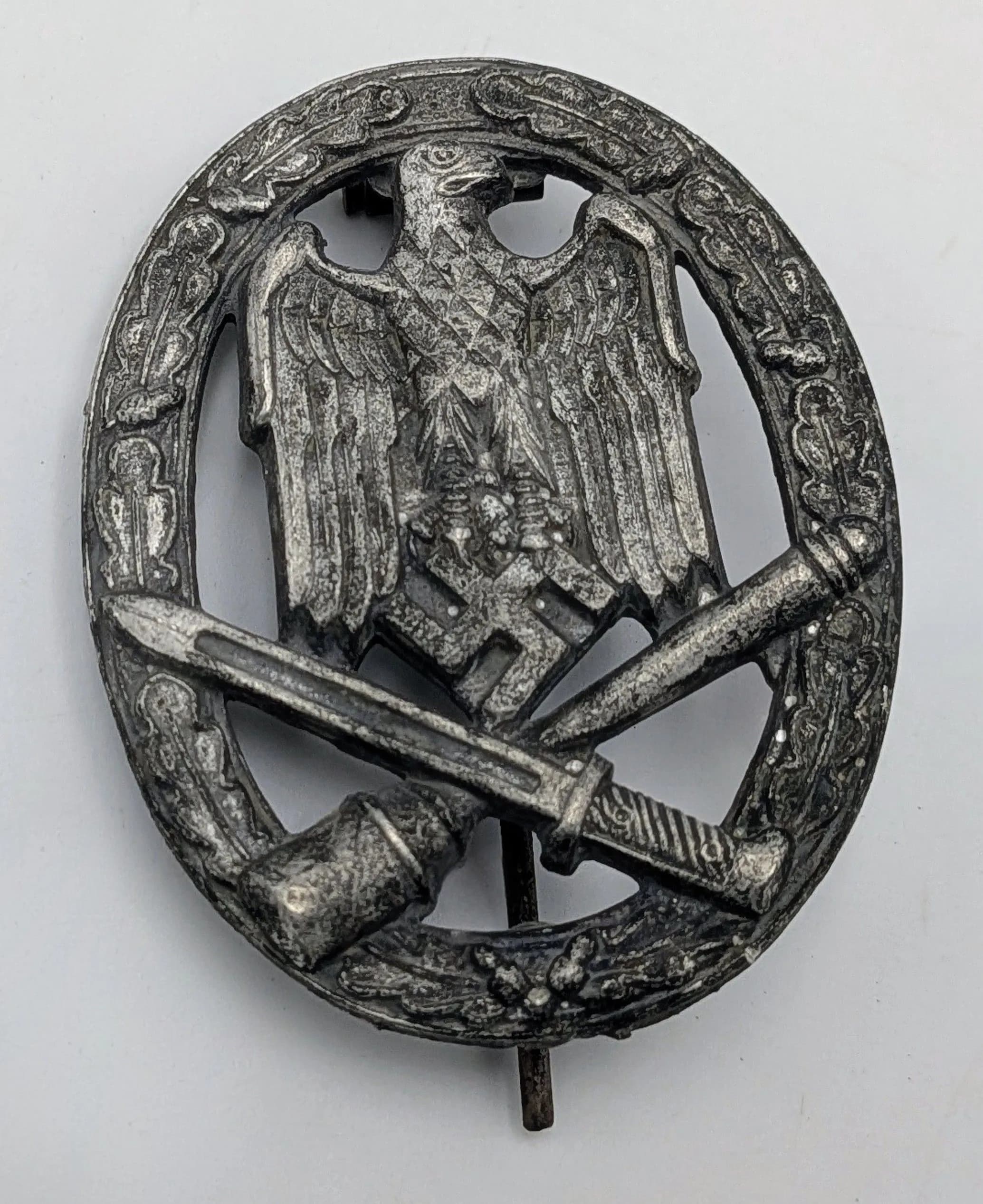 A 3rd Reich Mid War General Assault Badge. Maker marked Frank & Reif Stuttgart.
