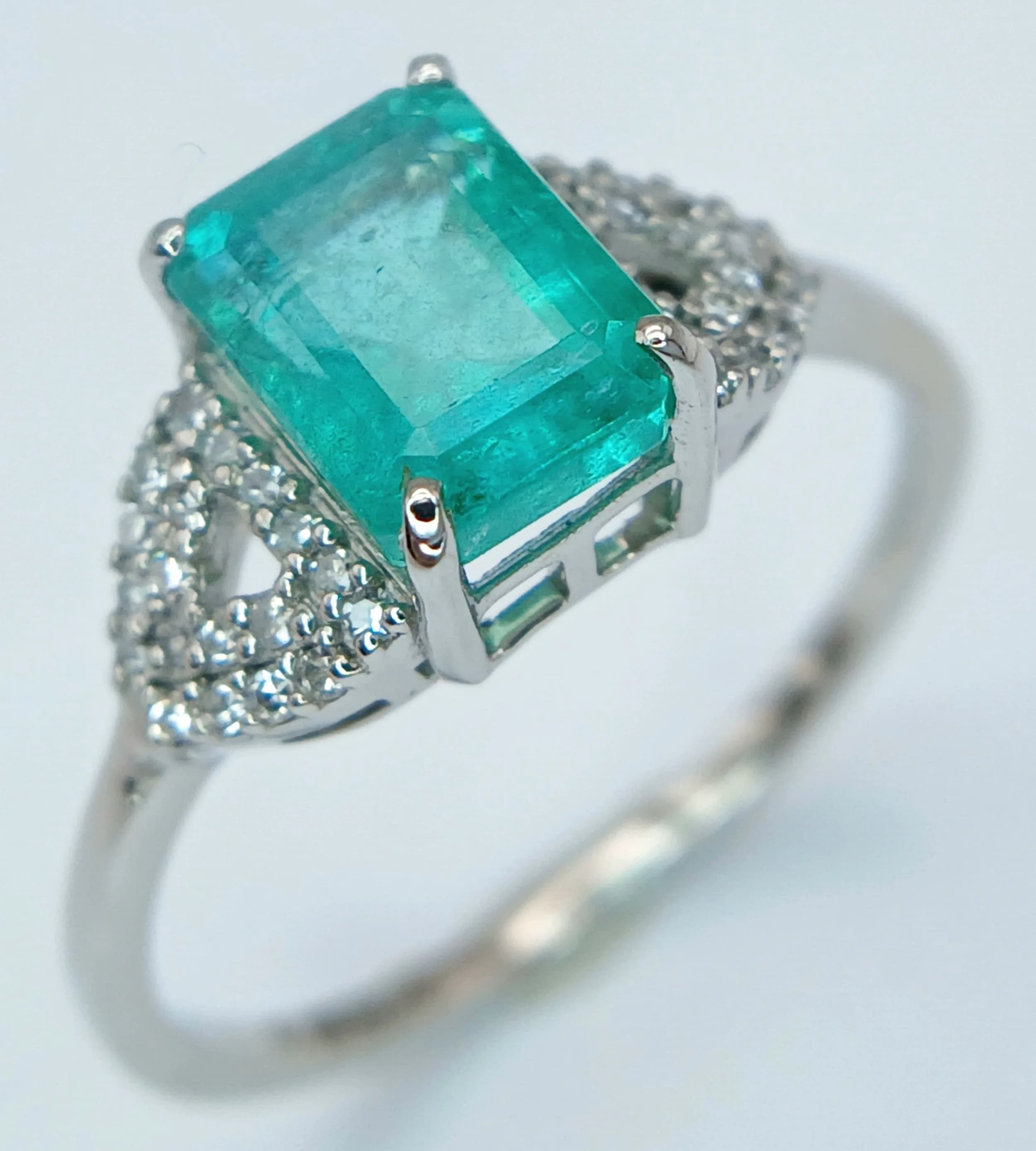 A 950 Platinum, Emerald and Diamond Cocktail Ring. 1.66ct octagon step cut emerald with a 0.12ctw diamond surround.Size N. 3.17g total weight. Comes with an HRD Antwerp certificate. Ref: CLR-12249.