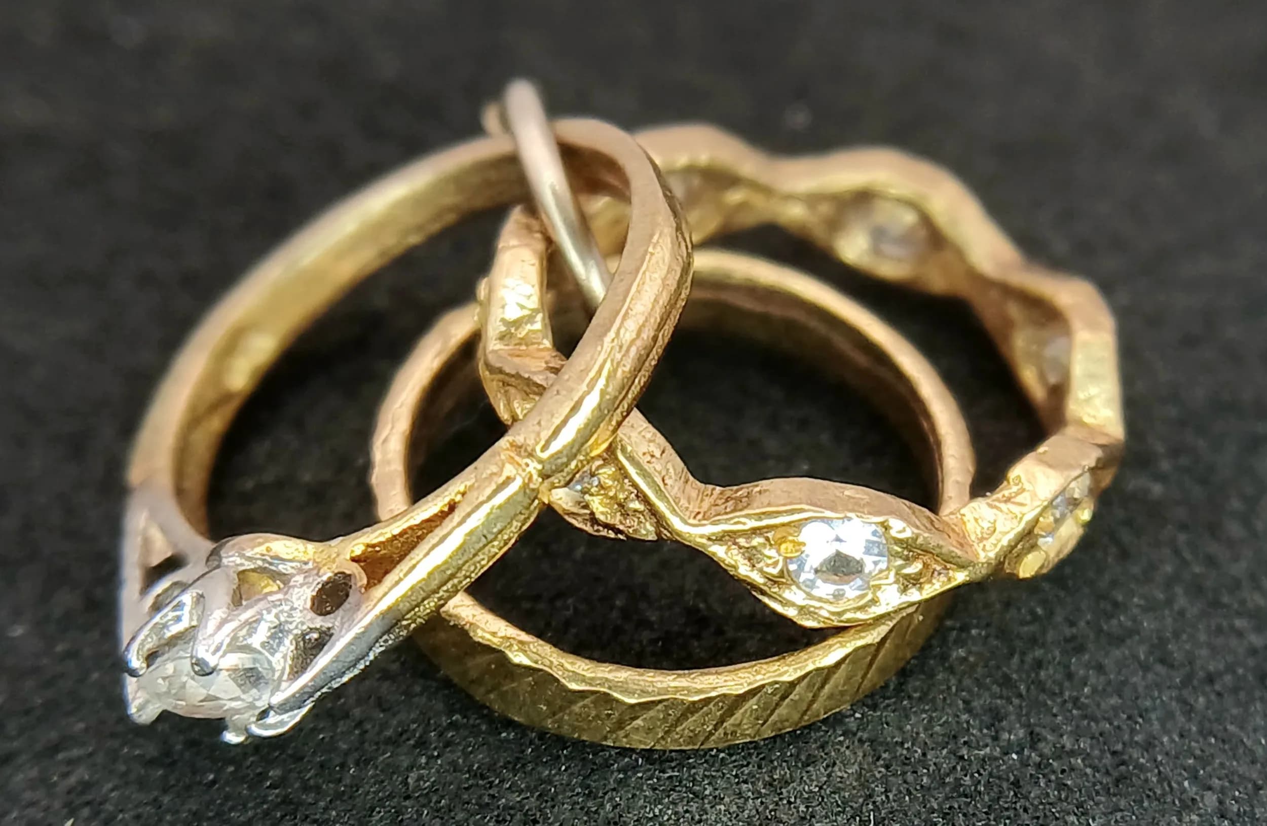 A 9K Yellow Gold Trinity Ring Pendant/Charm. 15mm. 2.4g total weight.