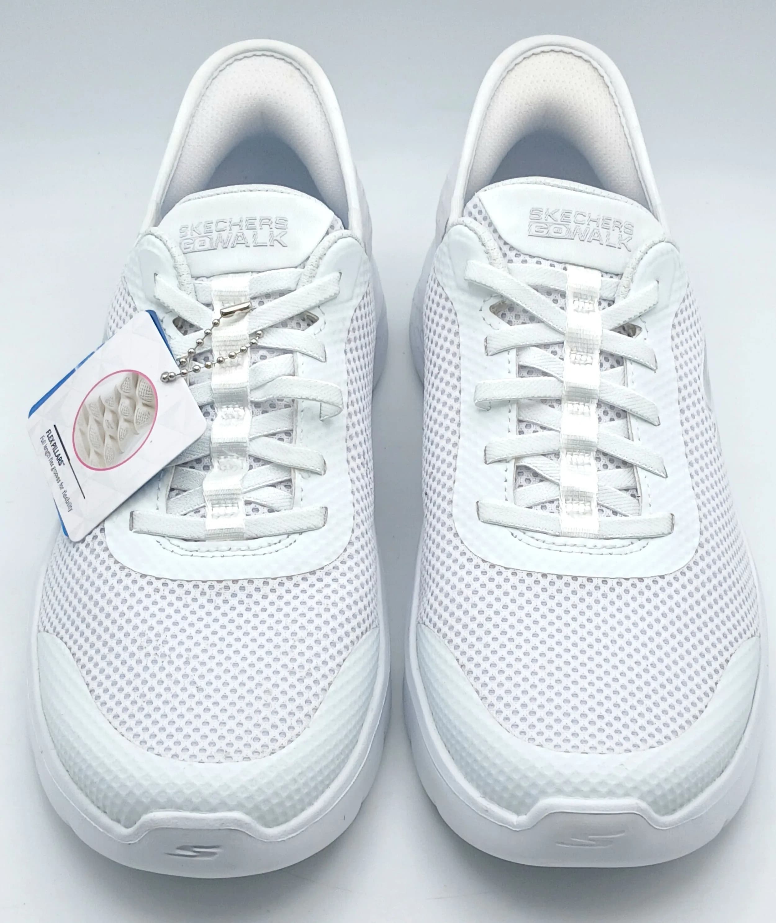 A pair of white mesh Sketchers slip-in trainers. New, no box. UK size 6, US size 9