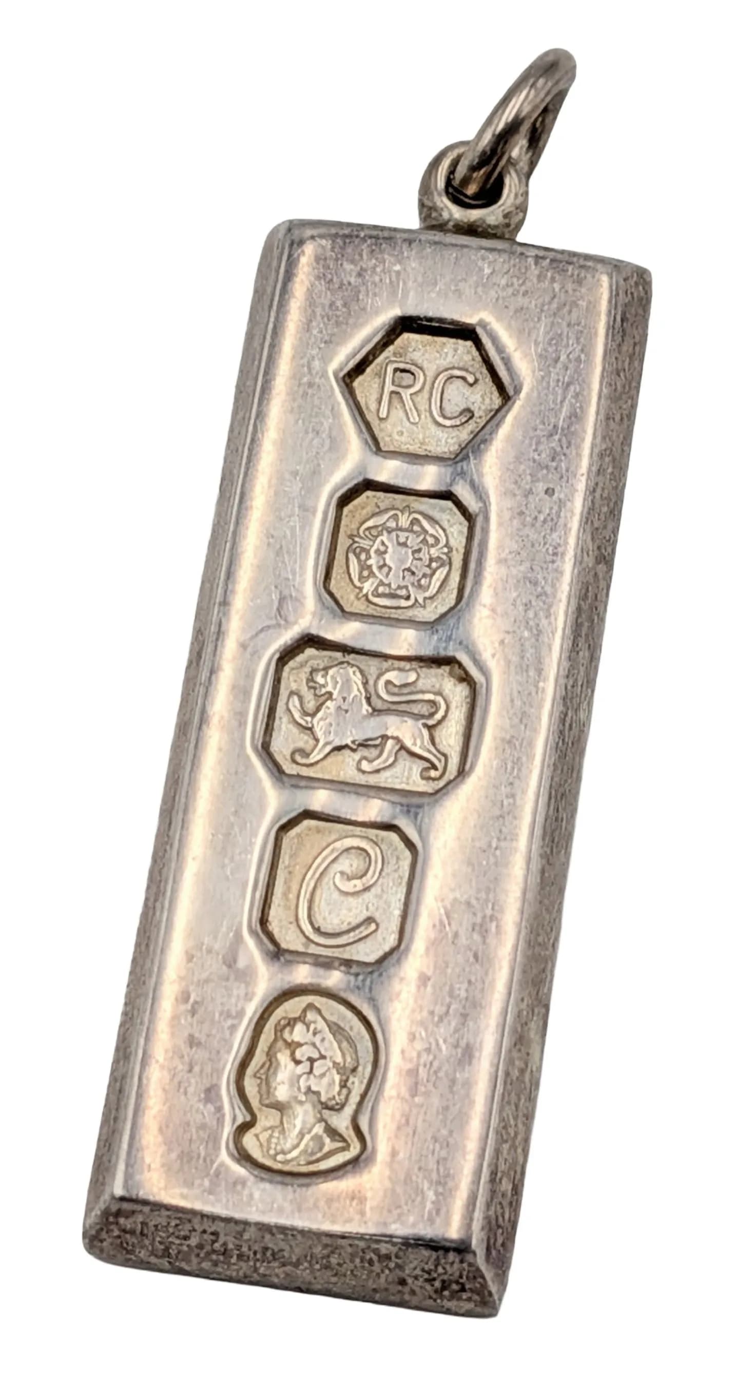 A Silver Ingot Pendant. Hallmarks for Sheffield, 1977. 29.27g weight.