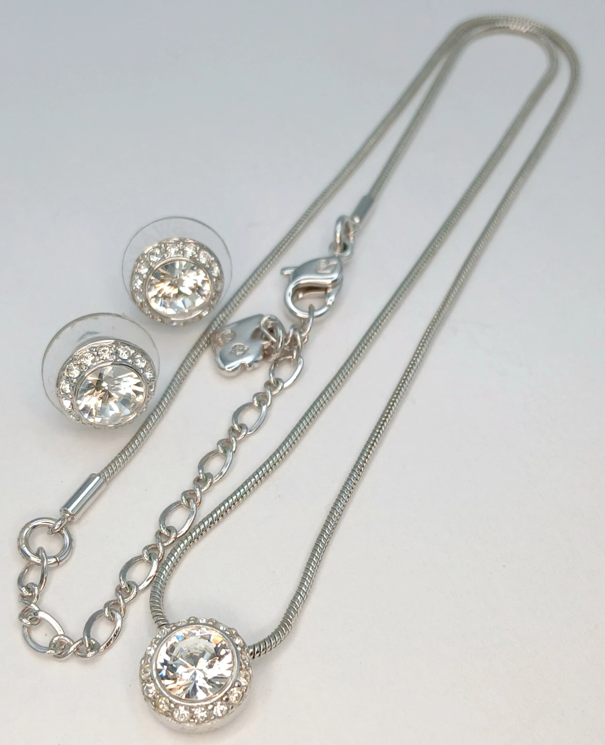 A Swarovski Angelic Halo Crystal Pendant Necklace and Matching Stud Earrings. Swarovski markings. 45cm length necklace.