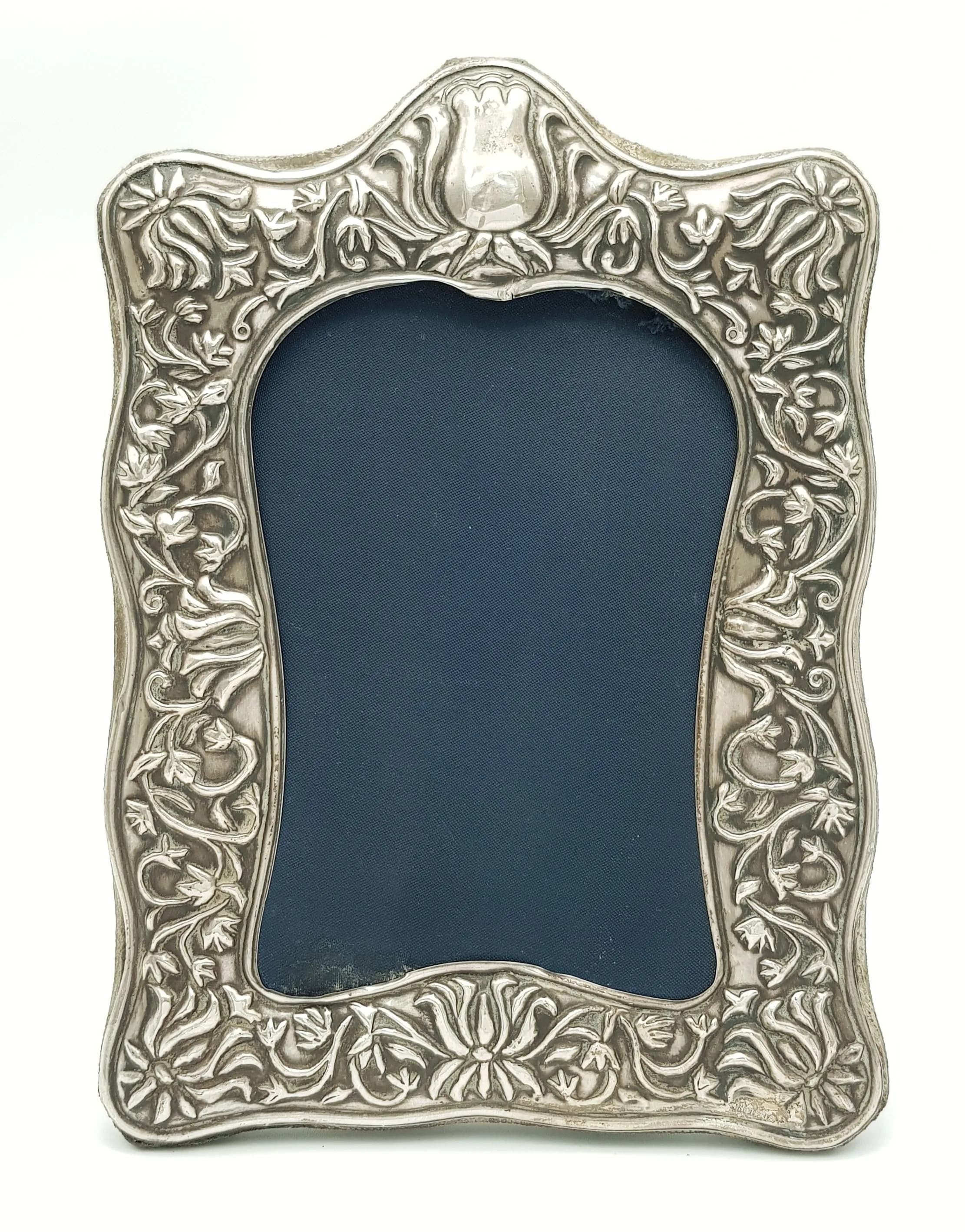 A VINTAGE SILVER PHOTO FRAME . 15 X 21cms