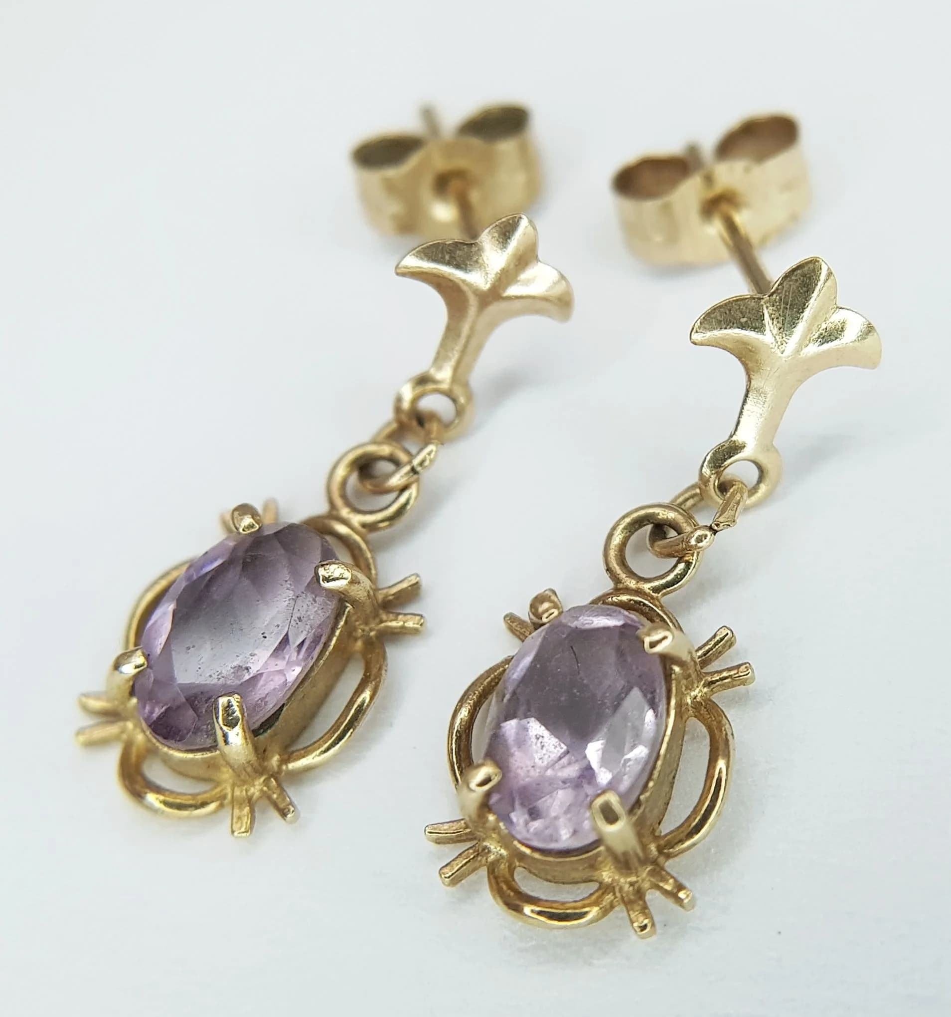 A Pair of 9K Yellow Gold and Amethyst Petit Drop Earrings. 0.95g total weight.