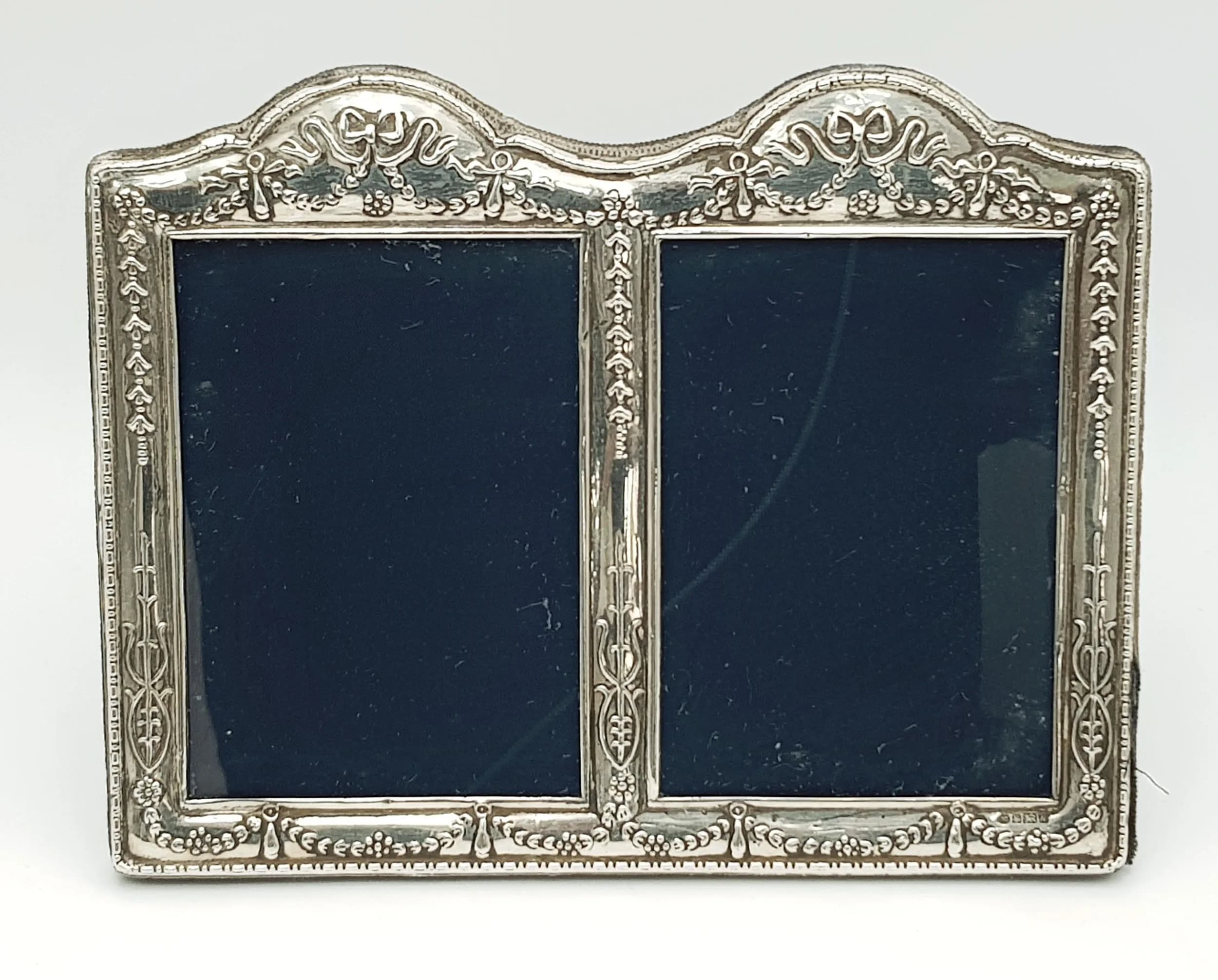 A VINTAGE SILVER DOUBLE PHOTO FRAME . 22 X 16cms