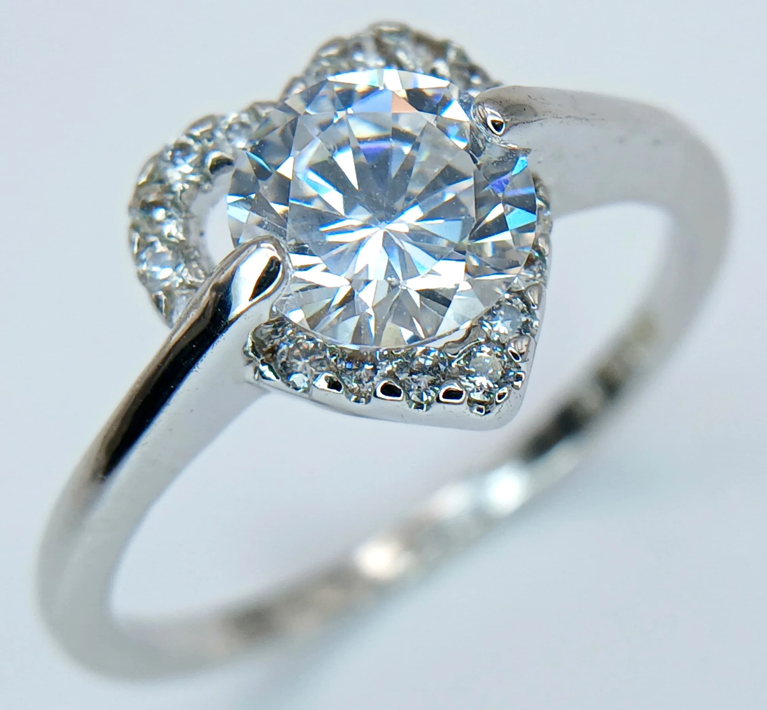 A 10k White Gold Filled Cubic Zirconia Love Heart Ring Size R. The Ring measures 1.1cm Wide at the Crown and has a gross weight of 2.49 grams.