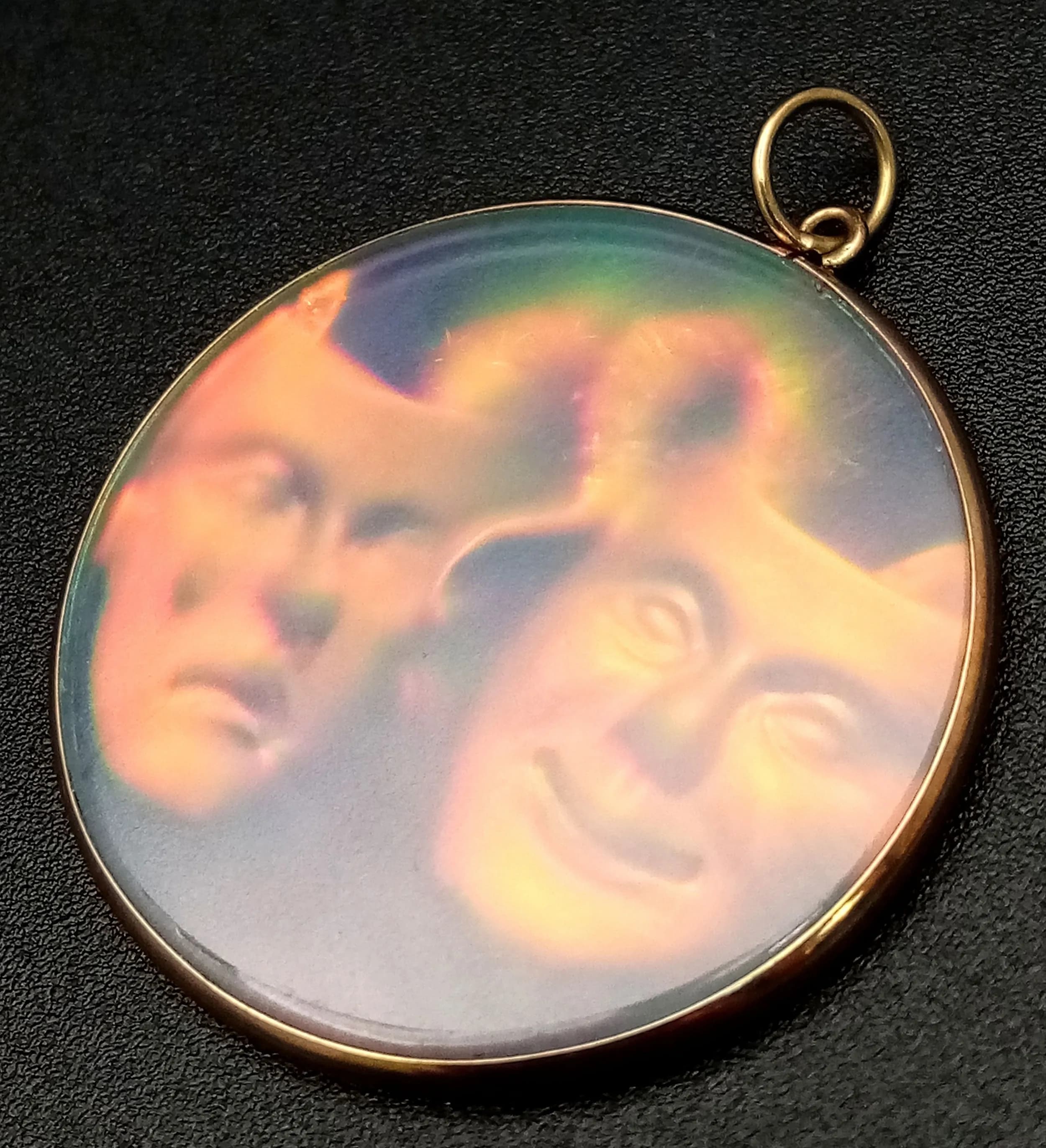 A Vintage Holographic Drama Mask Pendant - 9K gold setting. 3.5cm. 4.5g total weight.