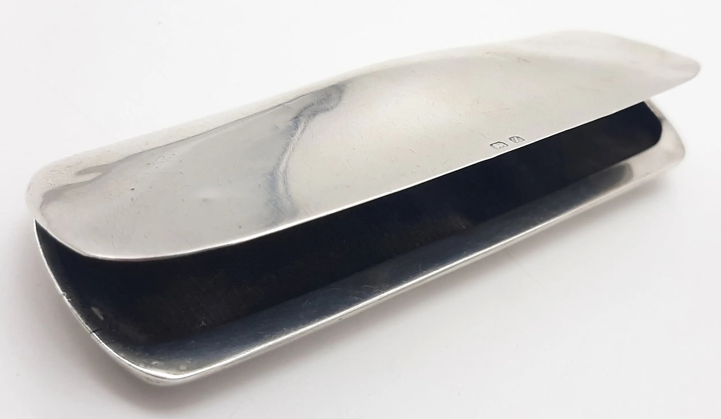 AN ANTIQUE SOLID SILVER GLASSES CASE . 45.5gms