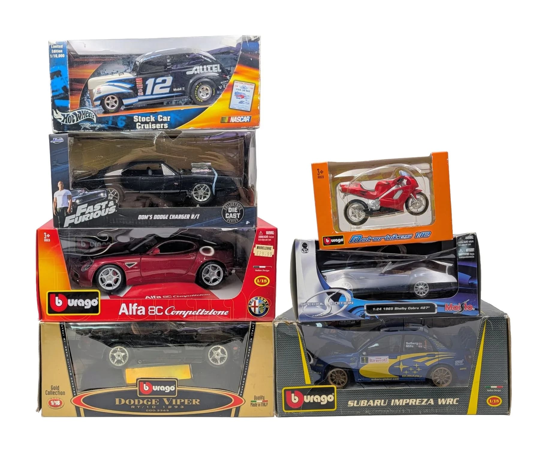 Seven die cast model cars. Various makes including Burago, Welly & Hotwheels, 1/18 & 1/24th scale. Some wear to boxes from storage.