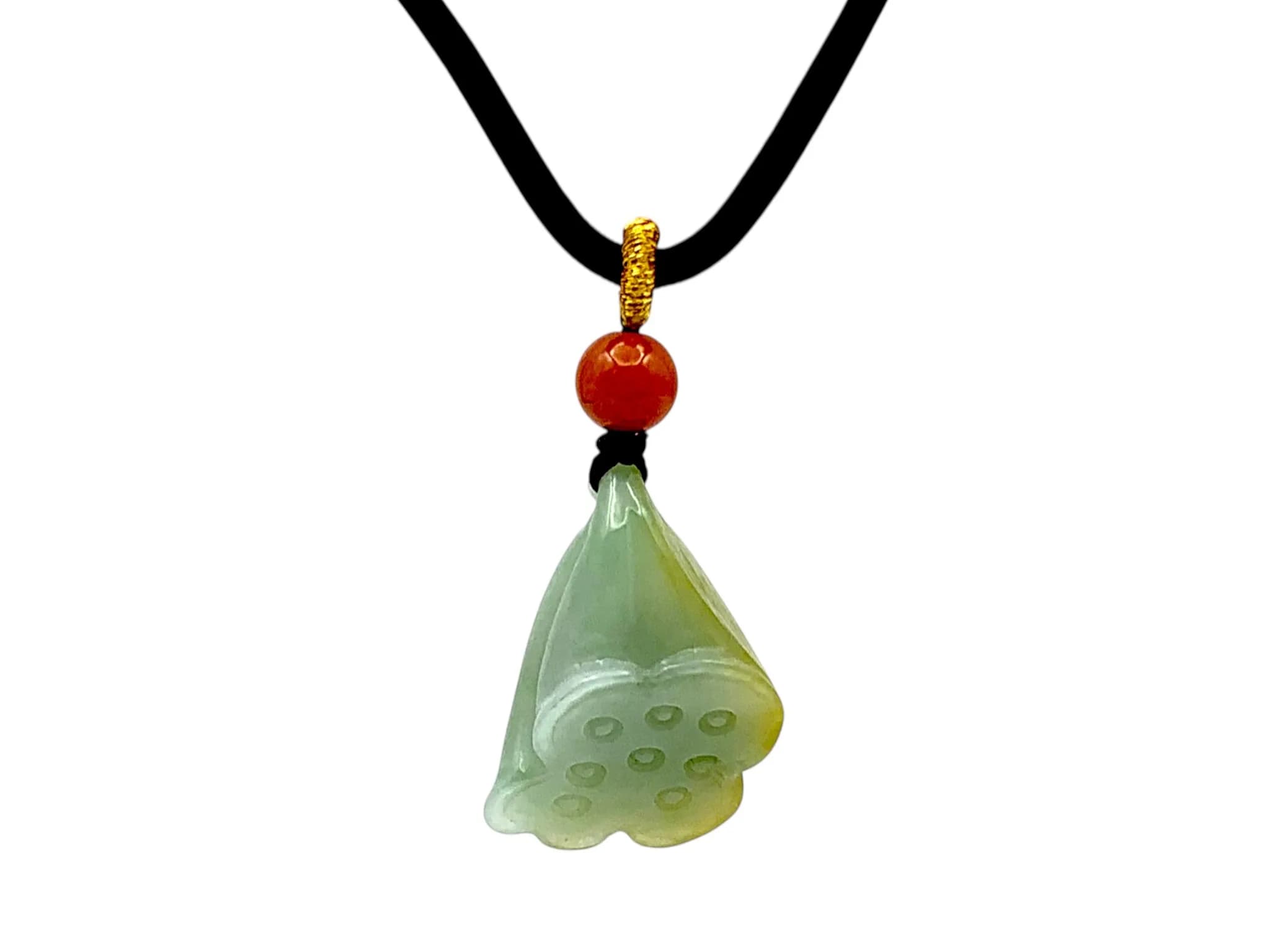 A Jade ‘Lotus Pod’ Pendant Necklace. Pale green jade, carved as a lotus pod, with areas of yellowish tone, suspended from a cord with a bead. Pendant height: approx. 3cm. Cord length: approx. 33cm (adjustable). Weight: approx. 11.4g.