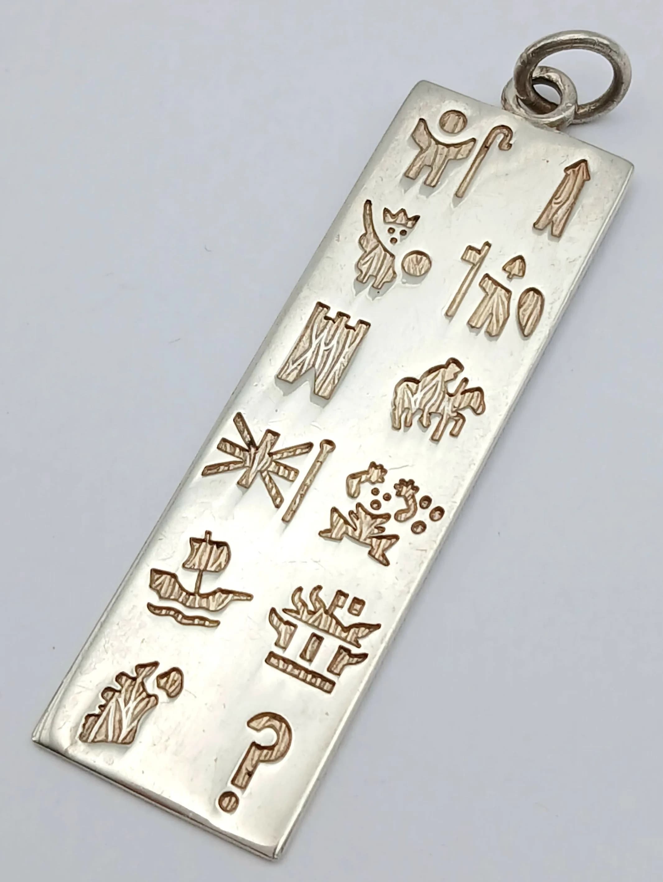 A STERLING SILVER, HIEROGLYPHS STYLE, INGOT PENDANT. 8.8G. A/S NN 6006