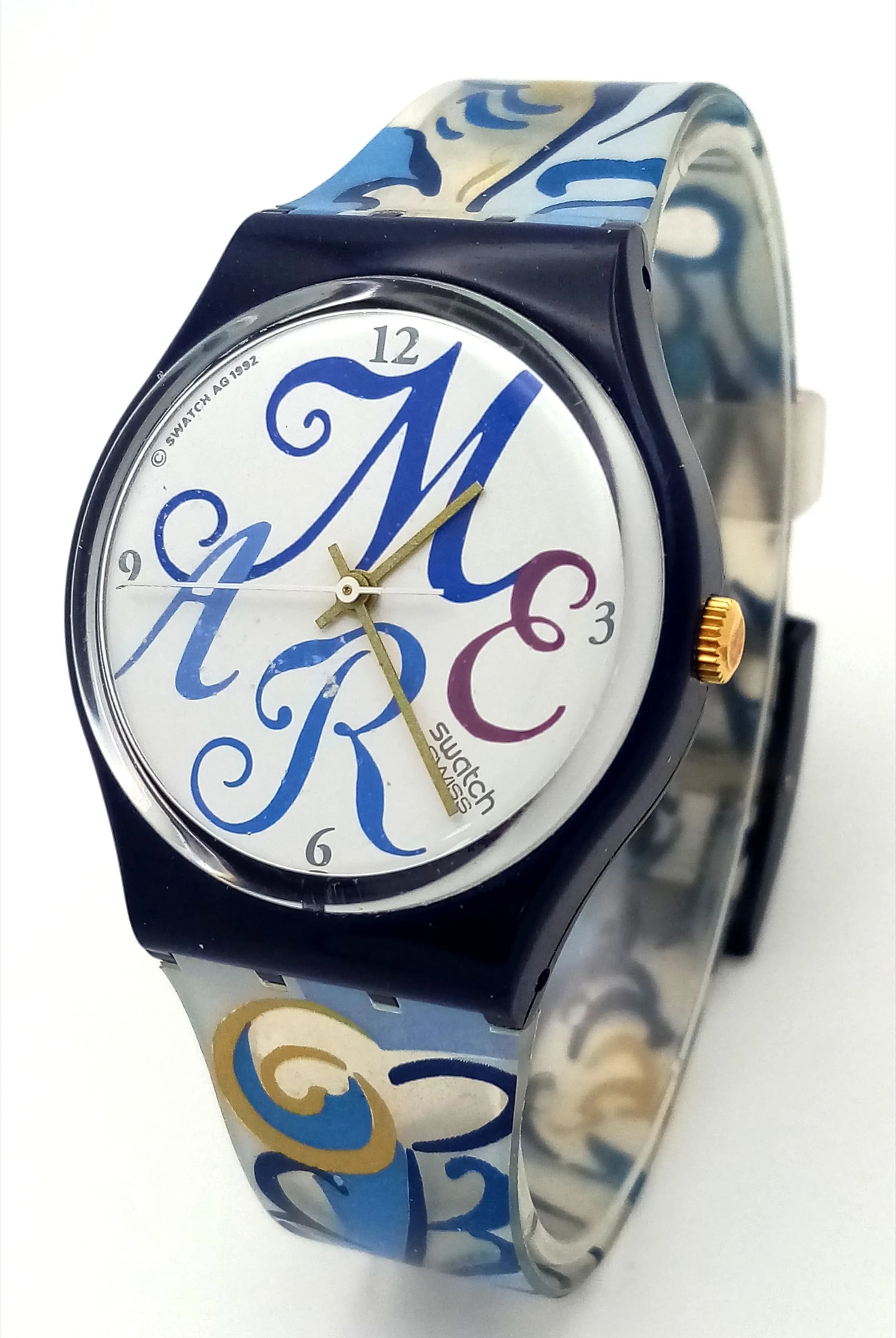 A 1993 SWATCH ALGARVE STRAP WATCH. MODEL GN128 IN ORIGINAL BOX AND WITH ORIGINAL PAPERWORK. IN FULL WORKING ORDER. NEW BATTERY FITTED RECENTLY. S/A 1703 - 1